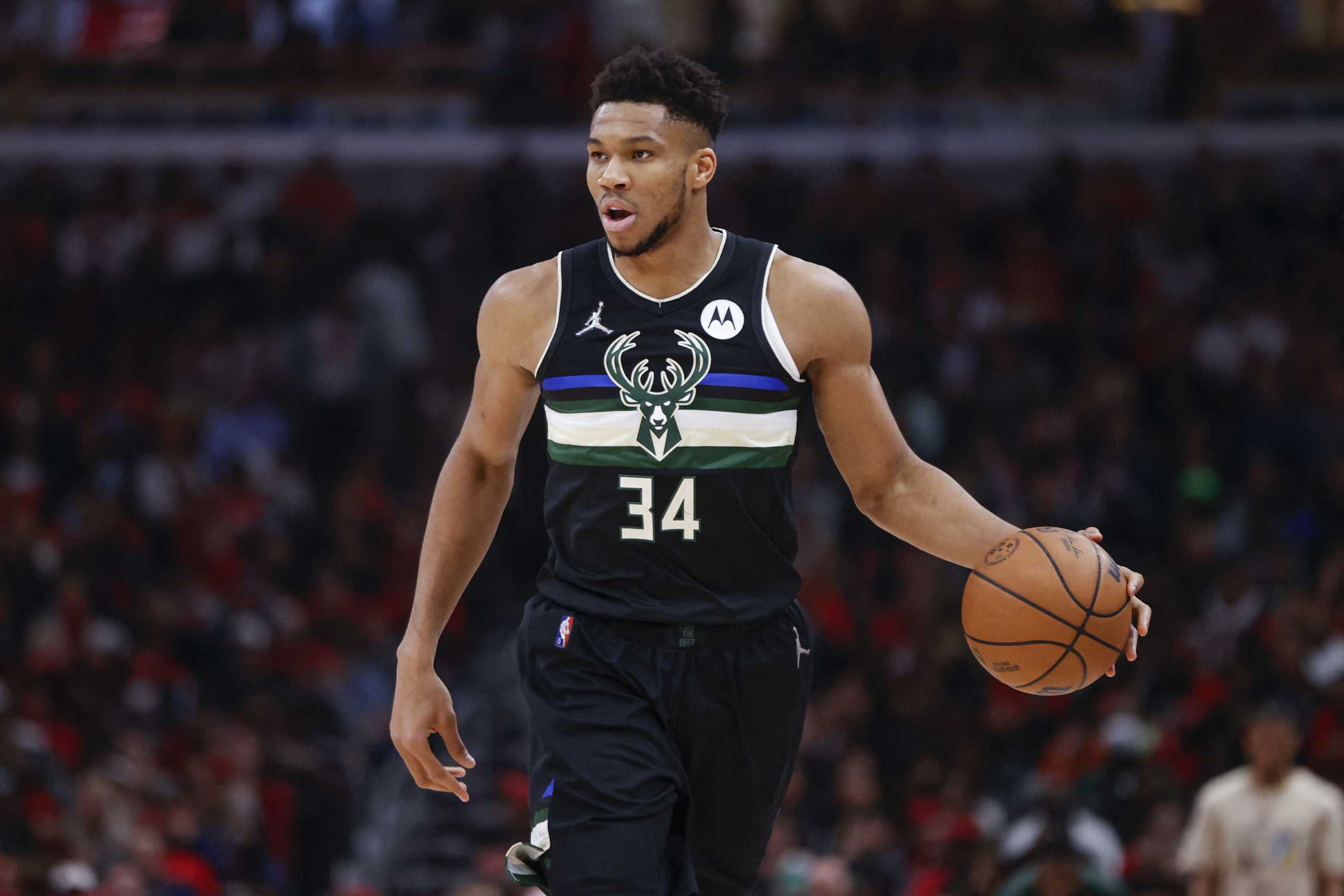 Apr 22, 2022; Chicago, Illinois, USA; Milwaukee Bucks forward Giannis Antetokounmpo (34) brings the ball up court against the Chicago Bulls during the first half of game three of the first round for the 2022 NBA playoffs at United Center. Mandatory Credit: Kamil Krzaczynski-USA TODAY Sports
