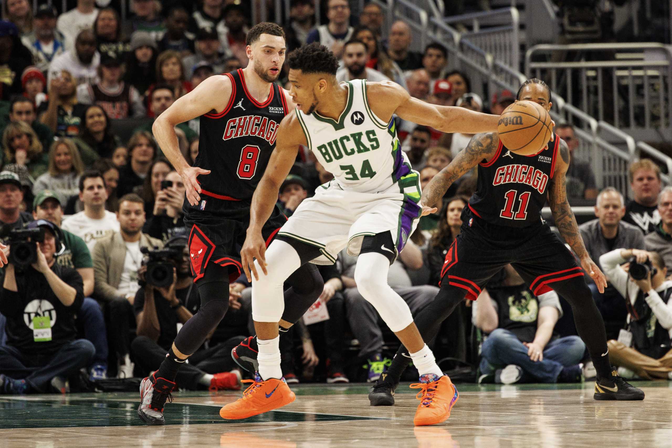 Apr 17, 2022; Milwaukee, Wisconsin, USA; Milwaukee Bucks forward Giannis Antetokounmpo (34) dribbles the ball as Chicago Bulls guard Zach LaVine (8) defends during the third quarter during game one of the first round for the 2022 NBA playoffs at Fiserv Forum. Mandatory Credit: Jeff Hanisch-USA TODAY Sports