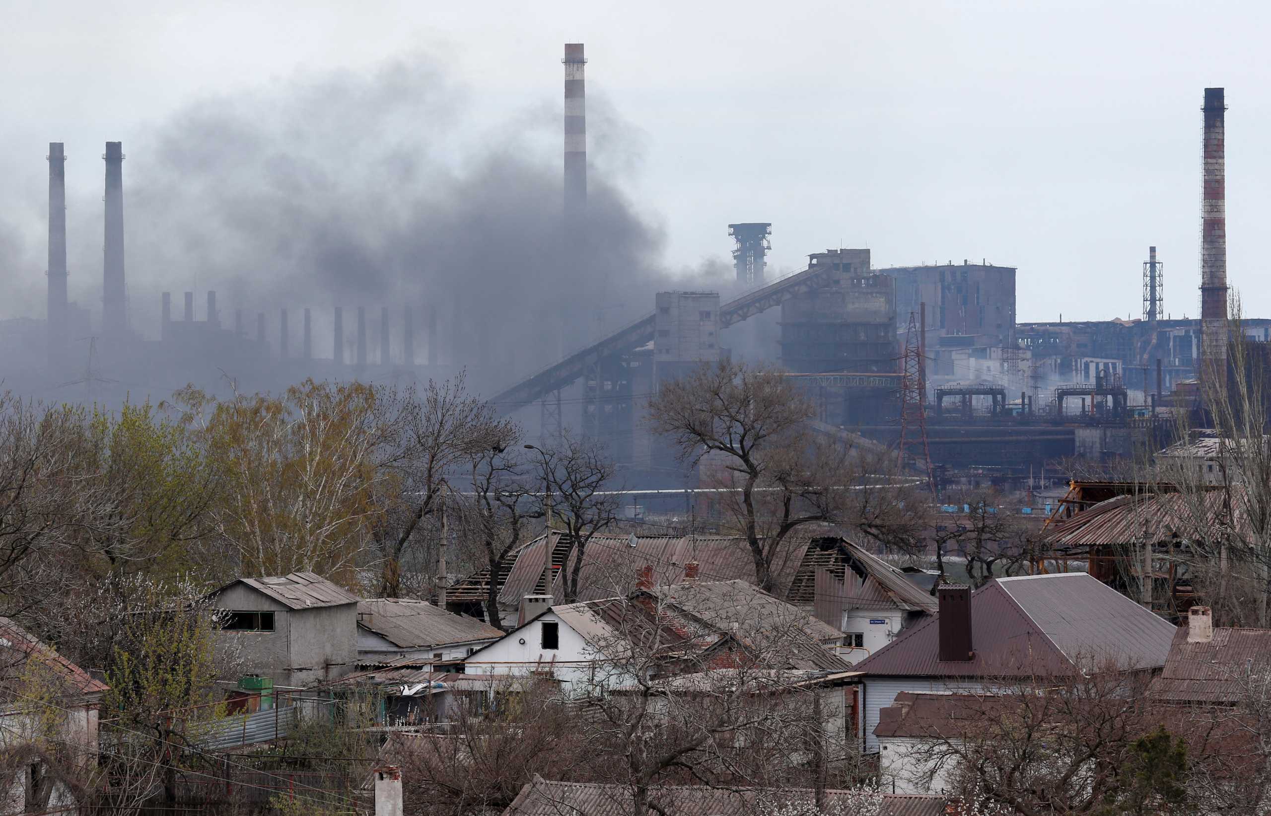 Smoke rises above a plant of Azovstal Iron and Steel Works during Ukraine-Russia conflict in the southern port city of Mariupol, Ukraine April 21, 2022. REUTERS