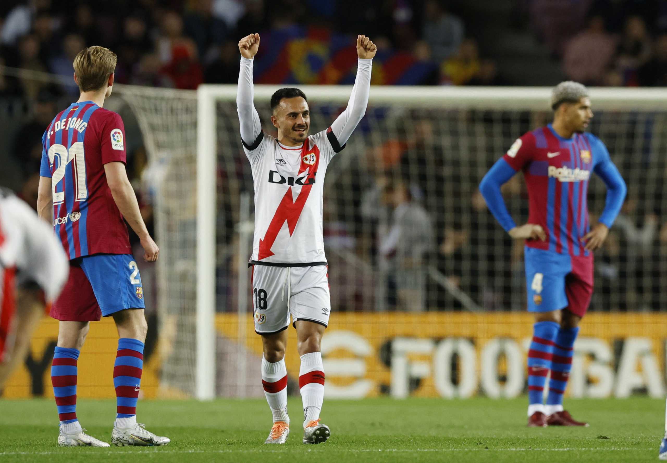 Soccer Football - LaLiga - FC Barcelona v Rayo Vallecano - Camp Nou, Barcelona, Spain - April 24, 2022 Rayo Vallecano's Alvaro Garcia celebrates scoring their first goal as FC Barcelona's Frenkie de Jong looks on REUTERS