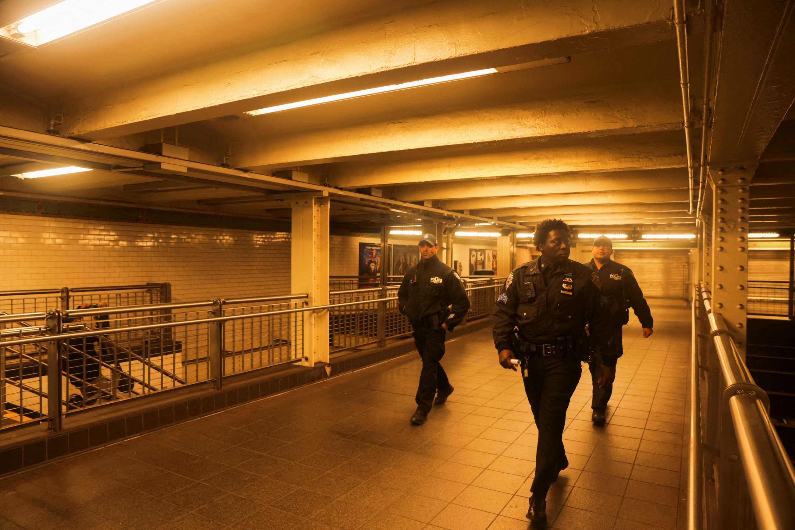 Metropolitan Transportation Authority workers check Manhattan subways after a shooting at a subway station in the Brooklyn borough of New York City, New York, U.S., April 12, 2022. REUTERS