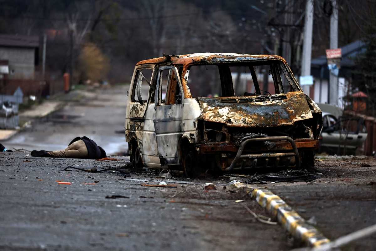 SENSITIVE MATERIAL. THIS IMAGE MAY OFFEND OR DISTURB    A body of a civilian, who according to residents was killed by Russian army soldiers, lies on the street, amid Russia's invasion of Ukraine, in Bucha, in Kyiv region, Ukraine April 2, 2022. REUTERS