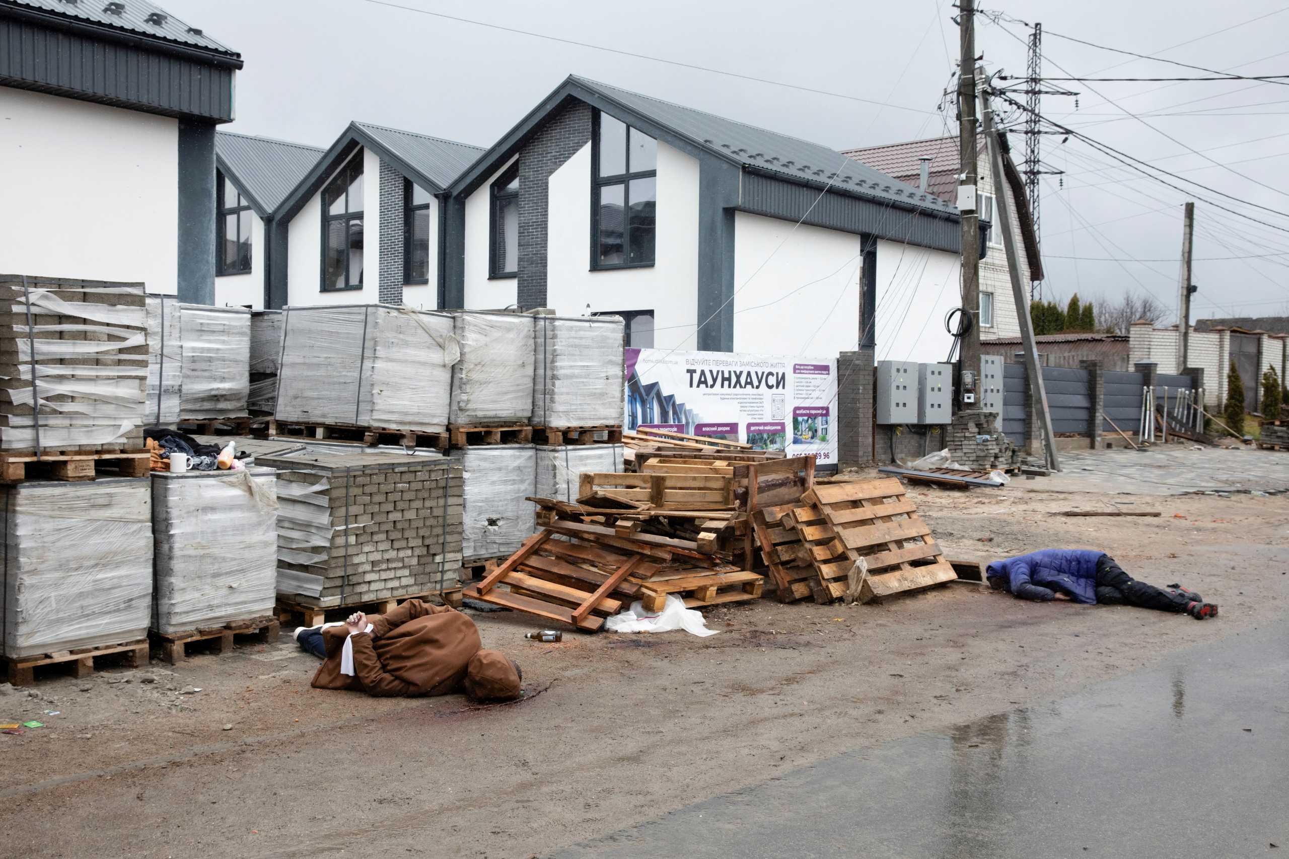 SENSITIVE MATERIAL. THIS IMAGE MAY OFFEND OR DISTURB    Bodies of people, who according to residents were shot by Russian soldiers, lie down on the street, amid Russia's invasion on Ukraine, in Bucha, Ukraine April 3, 2022. REUTERS