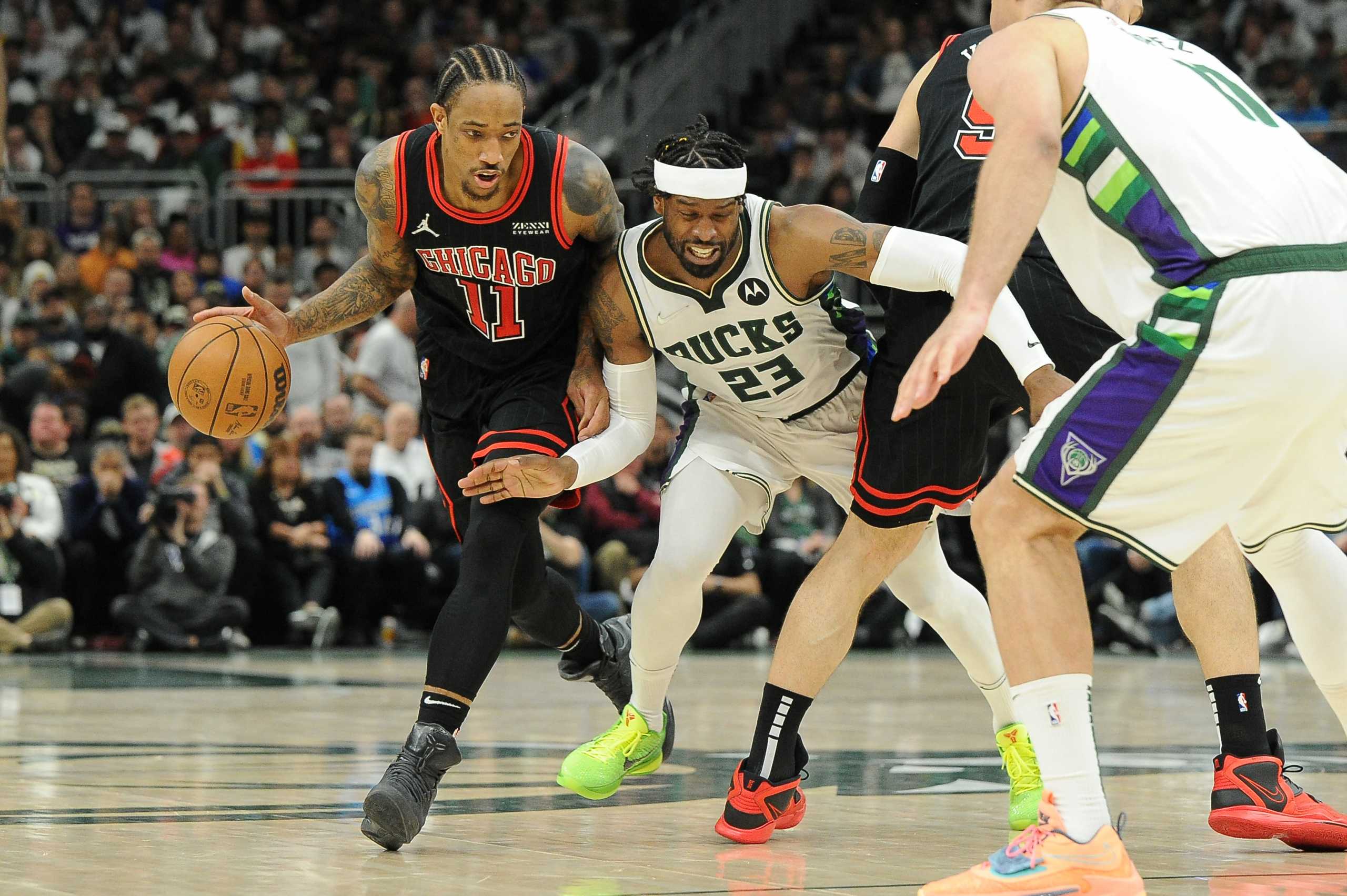 Apr 20, 2022; Milwaukee, Wisconsin, USA; Milwaukee Bucks guard Wesley Matthews (23) guards Chicago Bulls forward DeMar DeRozan (11) in the second half during game two of the first round for the 2022 NBA playoffs at Fiserv Forum. Mandatory Credit: Michael McLoone-USA TODAY Sports