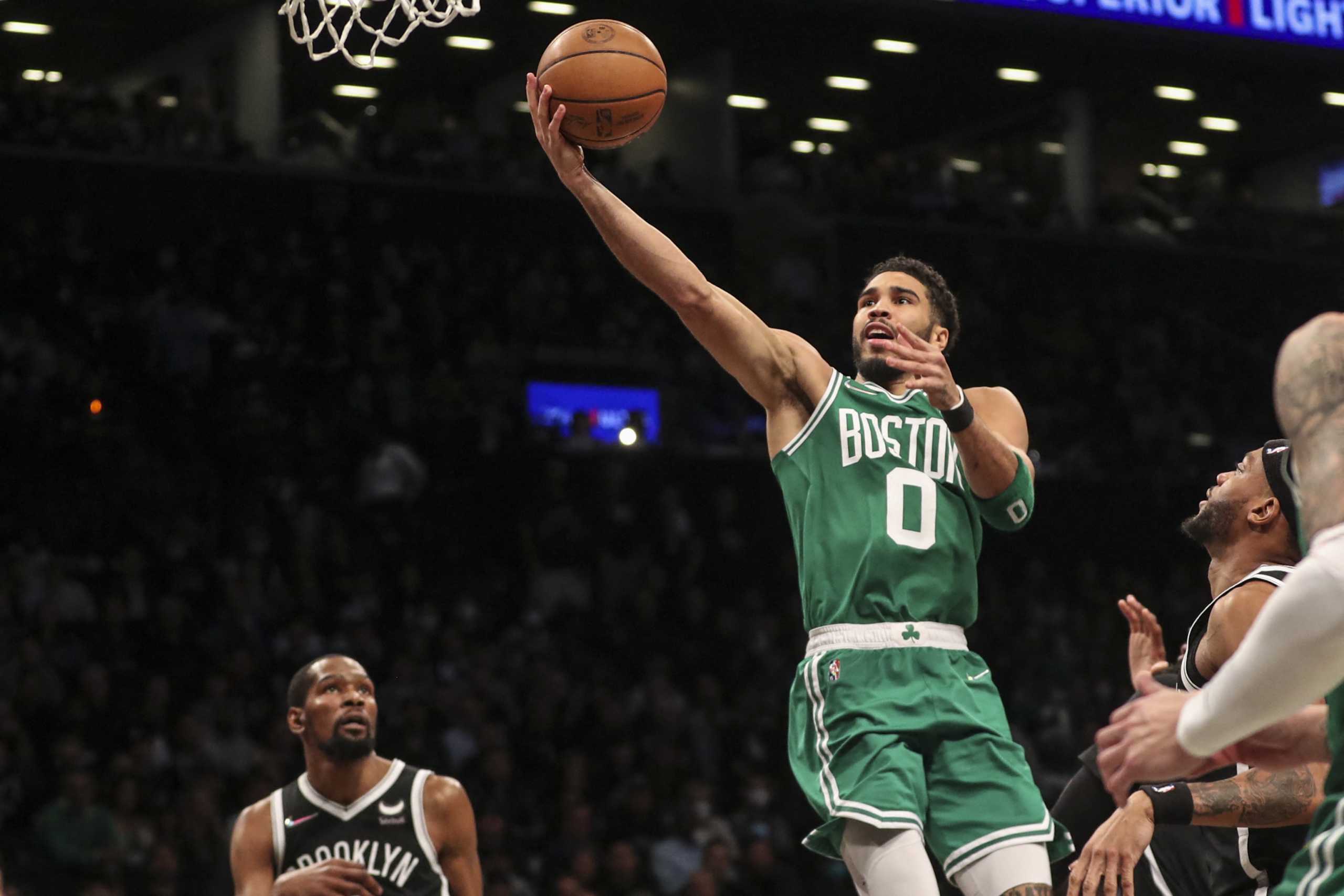 Apr 23, 2022; Brooklyn, New York, USA;  Boston Celtics forward Jayson Tatum (0) goes in for a layup in the first quarter against the Brooklyn Nets at Barclays Center. Mandatory Credit: Wendell Cruz-USA TODAY Sports