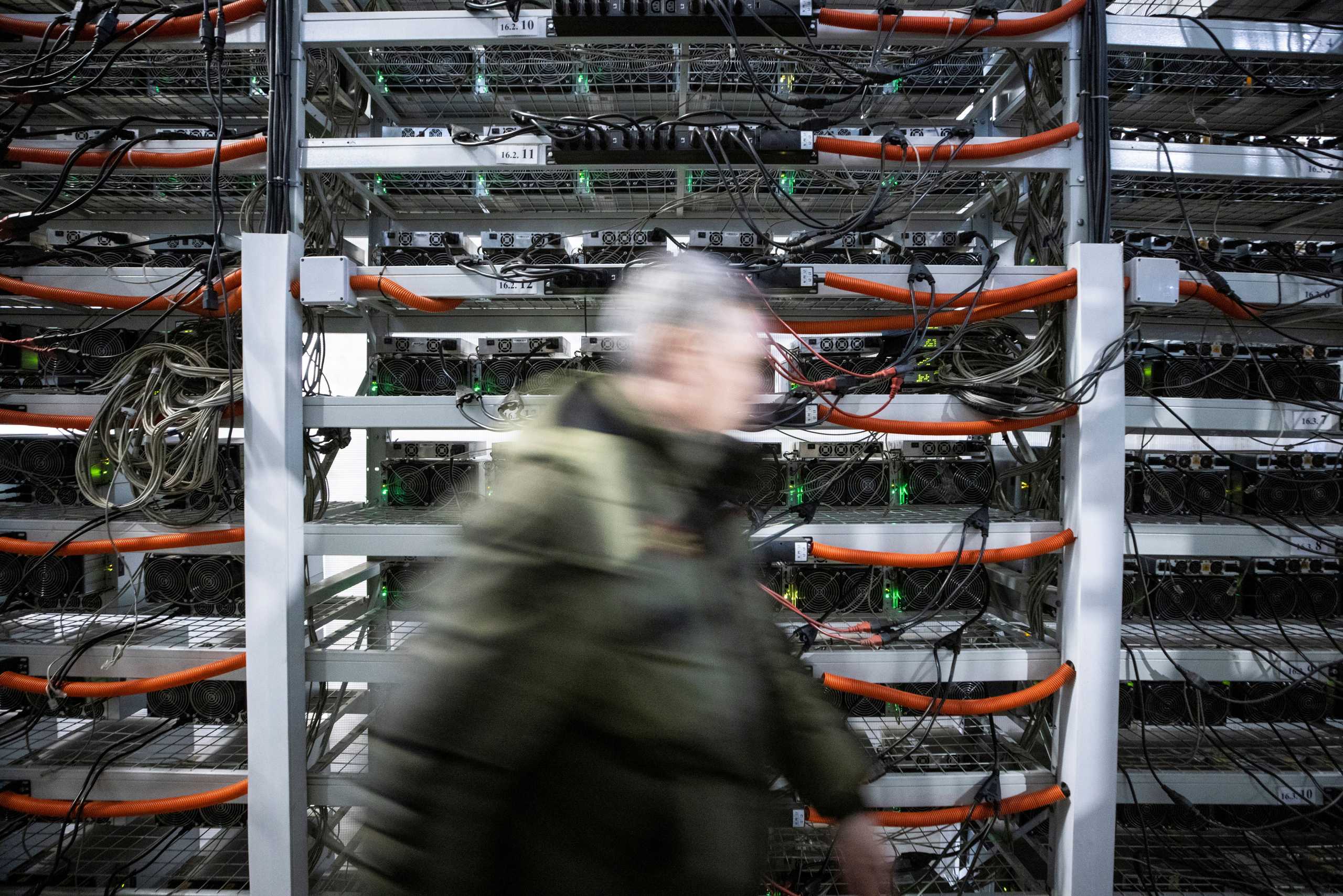 FILE PHOTO: A view shows equipment at the data centre of BitRiver company providing services for cryptocurrency mining in the city of Bratsk in Irkutsk Region, Russia March 2, 2021. BitRiver offers hosting services and turnkey solutions for cryptocurrency mining operations to institutional investors including bitcoin mining firms. Picture taken March 2, 2021. REUTERS