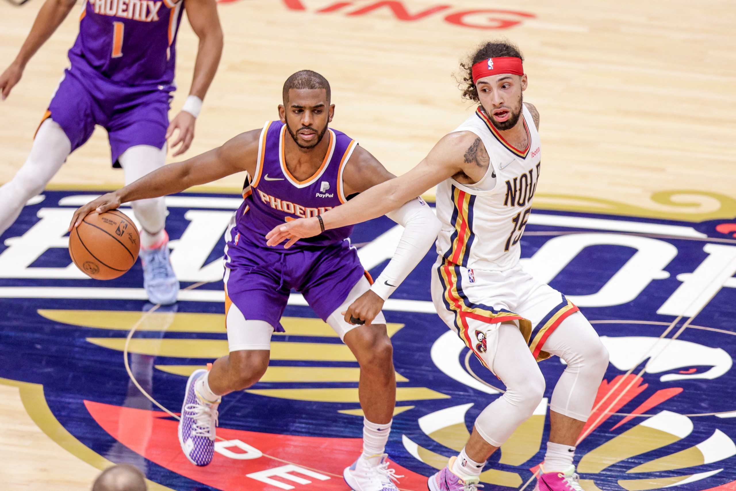 Apr 28, 2022; New Orleans, Louisiana, USA;  New Orleans Pelicans guard Jose Alvarado (15) reaches back for a steal attempt on Phoenix Suns guard Chris Paul (3) during the second half of game six of the first round for the 2022 NBA playoffs at Smoothie King Center. Mandatory Credit: Stephen Lew-USA TODAY Sports