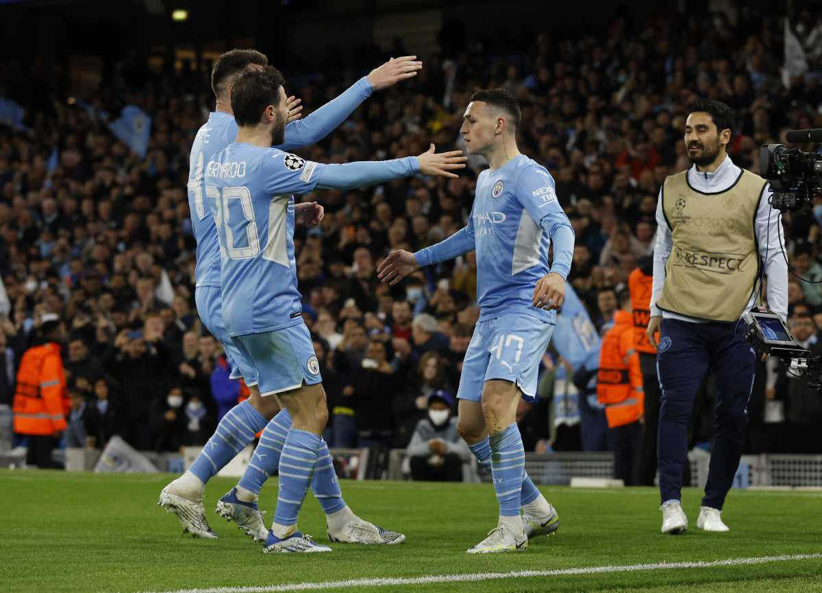 Soccer Football - Champions League - Semi Final - First Leg - Manchester City v Real Madrid - Etihad Stadium, Manchester, Britain - April 26, 2022 Manchester City's Phil Foden celebrates scoring their third goal with teammates Action Images via Reuters