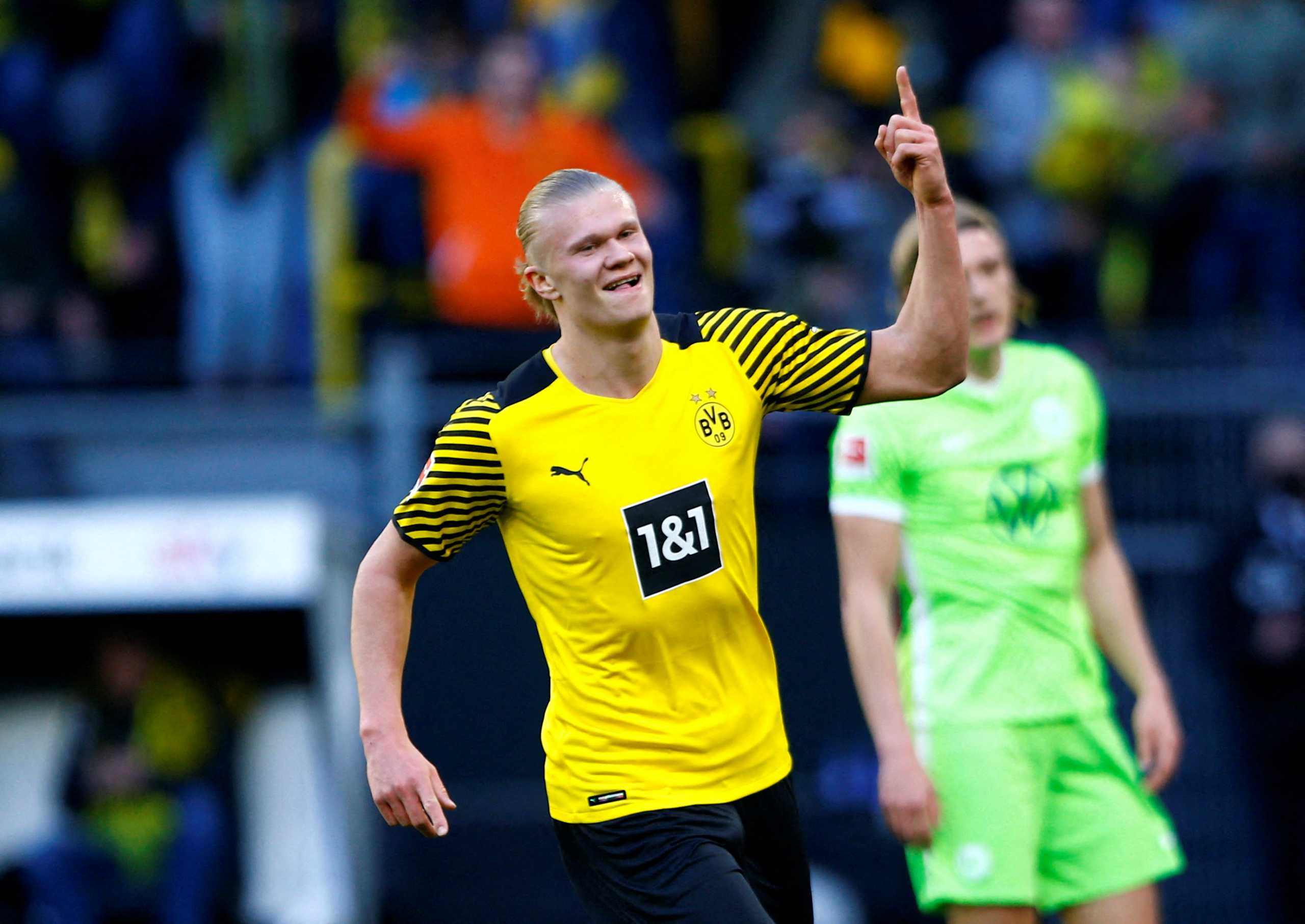 Soccer Football - Bundesliga - Borussia Dortmund v VfL Wolfsburg - Signal Iduna Park, Dortmund, Germany - April 16, 2022 Borussia Dortmund's Erling Braut Haaland celebrates their second goal scored by Axel Witsel REUTERS
