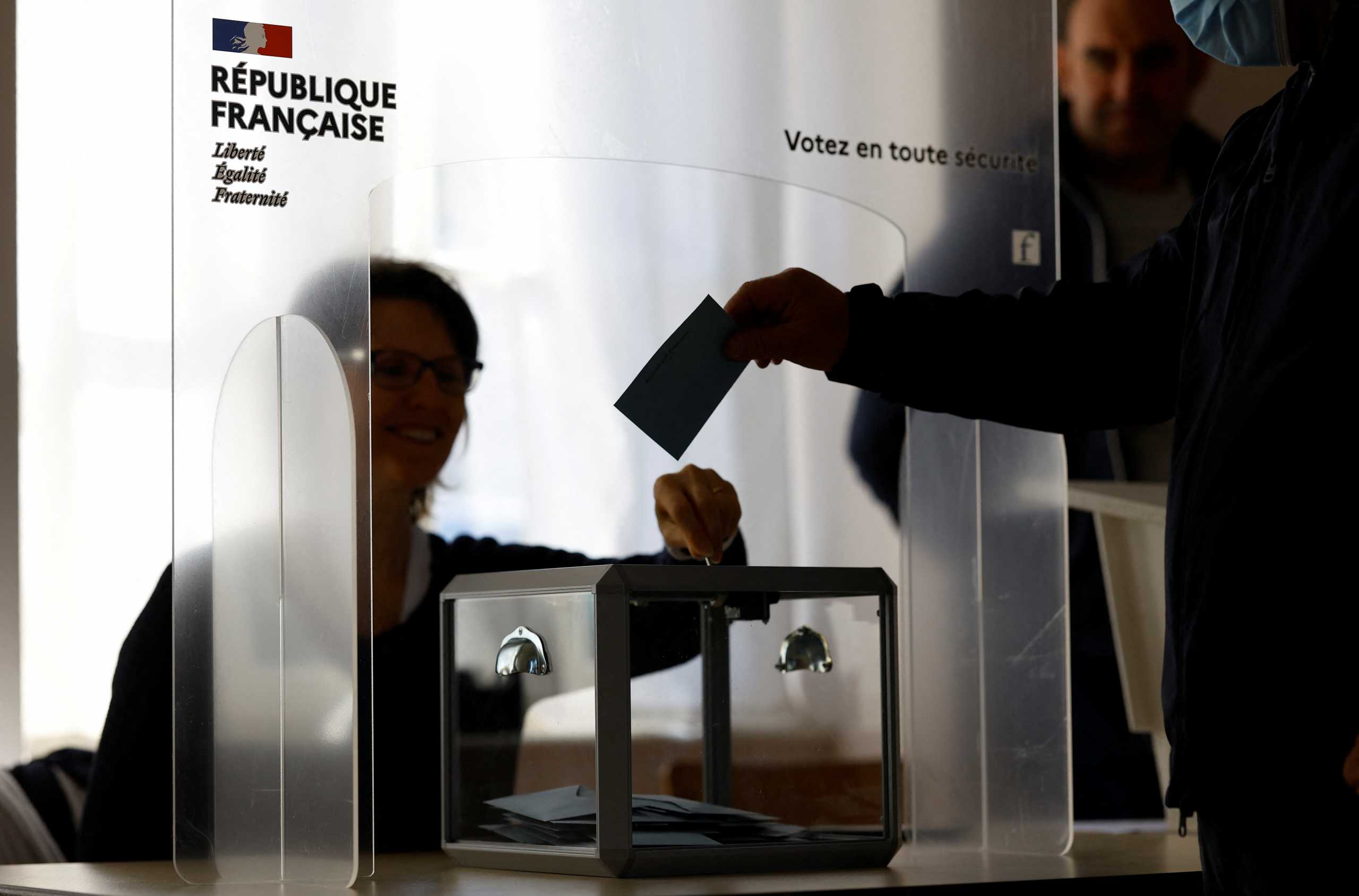 A man casts his ballot in the first round of the 2022 French presidential election at the polling station in La Villetelle, France, April 10, 2022. REUTERS