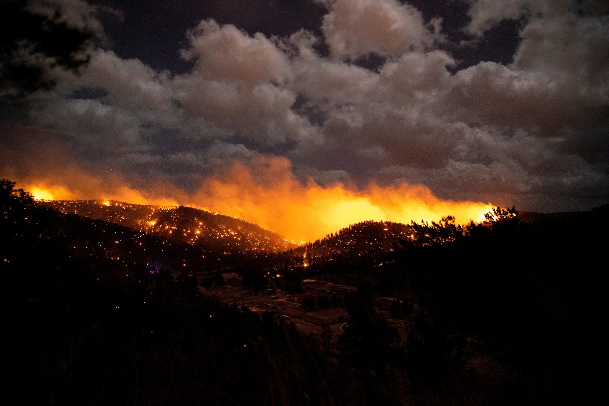 FILE PHOTO: The McBride Fire burns in the heart of the village in Ruidoso, New Mexico, United States, April 12, 2022. Picture taken April 12, 2022.  Ivan Pierre Aguirre