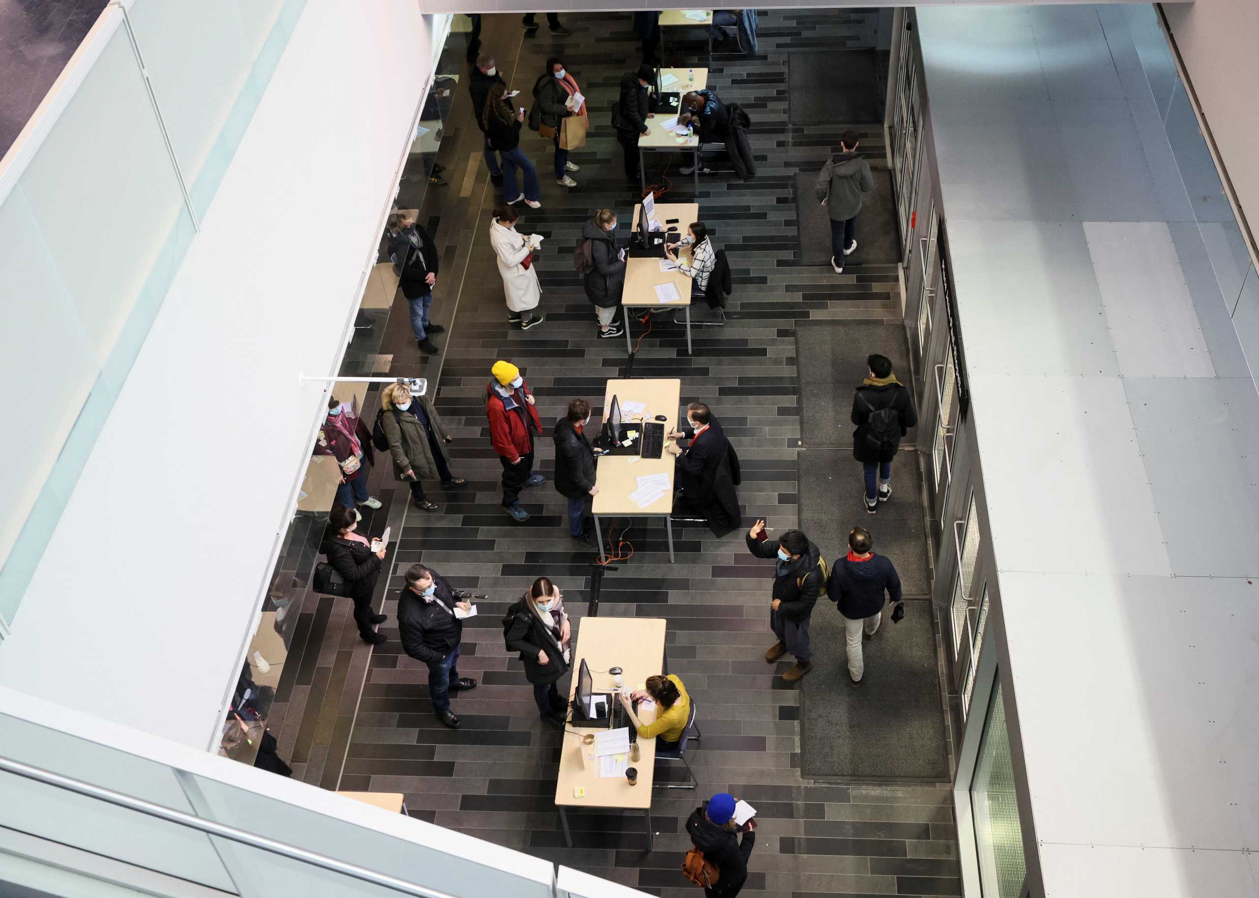 French citizens wait in line to cast their votes in the first round of the France's presidential election at the Palais des Congres in Montreal, Quebec, Canada, April 9, 2022. REUTERS