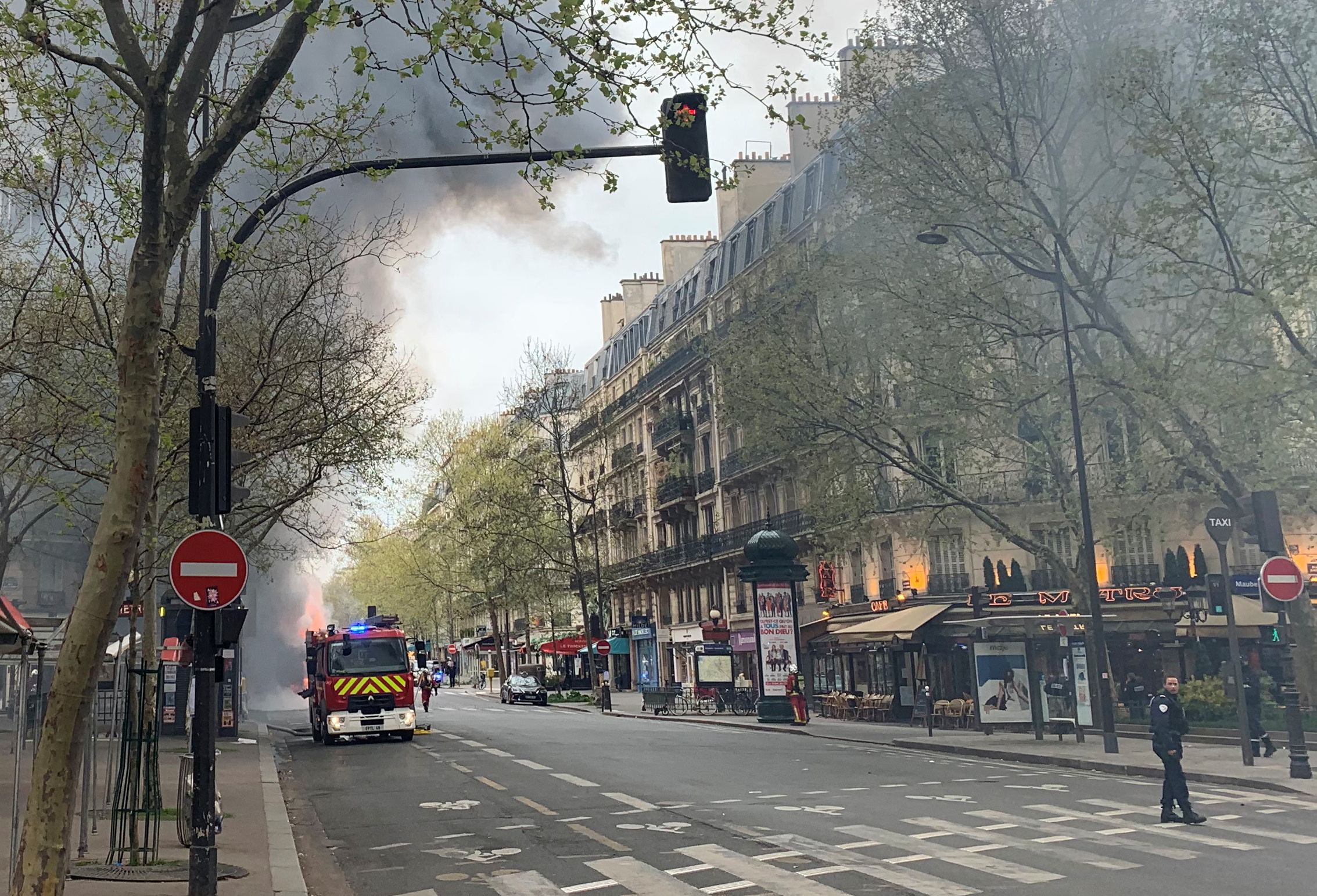 Firefighters work at the scene where a RATP bus caught fire in Paris, France April 4, 2022. REUTERS