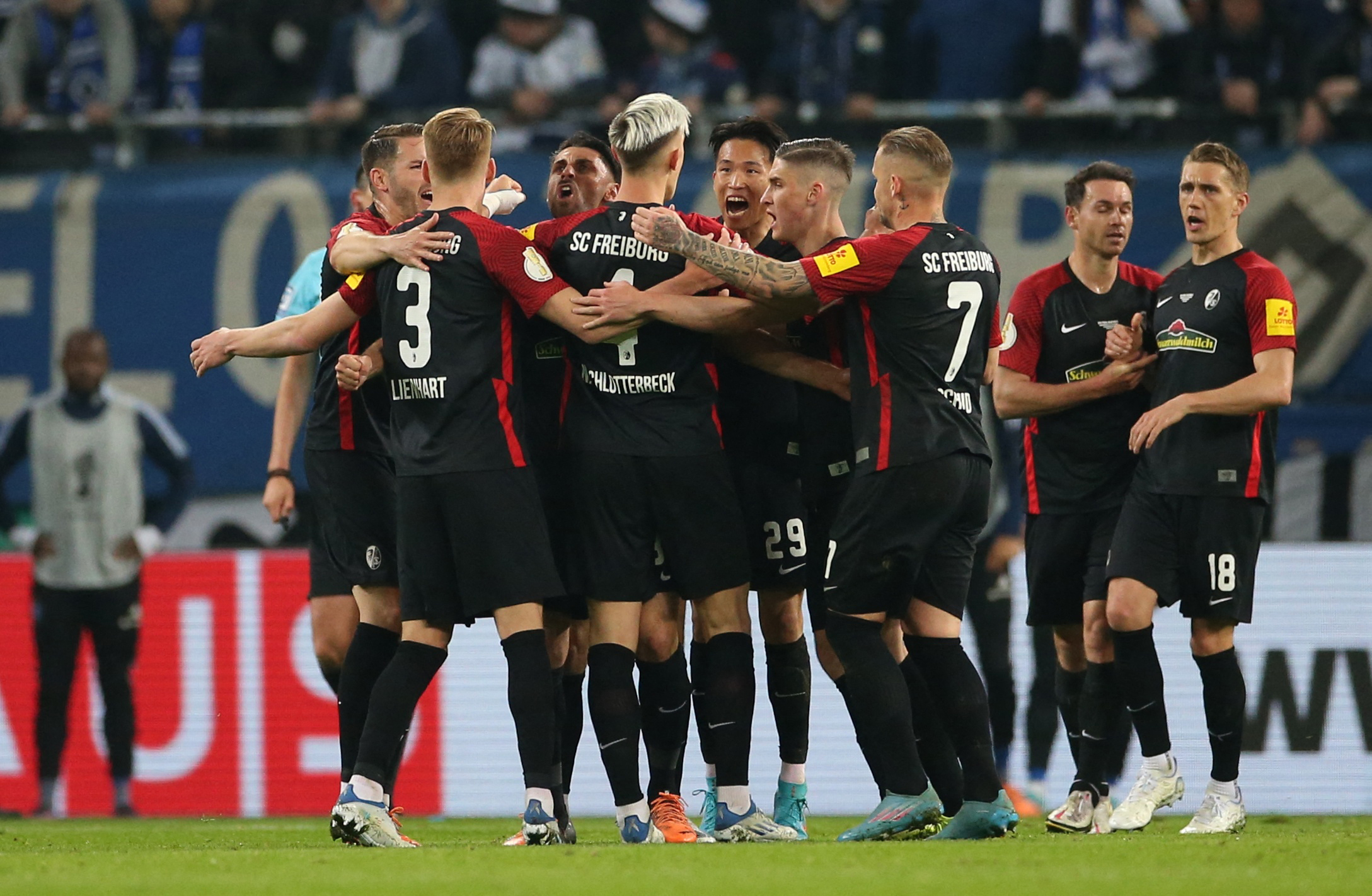 Soccer Football - DFB Cup - Semi Final - Hamburg SV v SC Freiburg - Volksparkstadion, Hamburg, Germany - April 19, 2022 SC Freiburg's Vincenzo Grifo celebrates scoring their third goal with teammates REUTERS