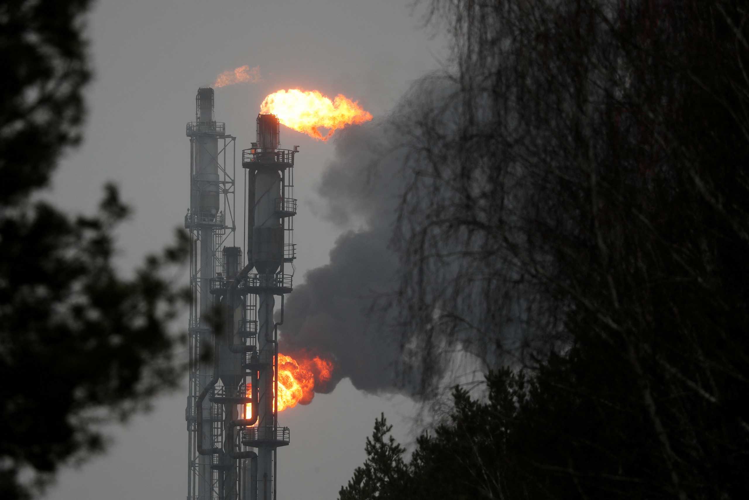 FILE PHOTO: A flame burning natural gas is seen near the town of Mozyr, Belarus January 4, 2020.  REUTERS
