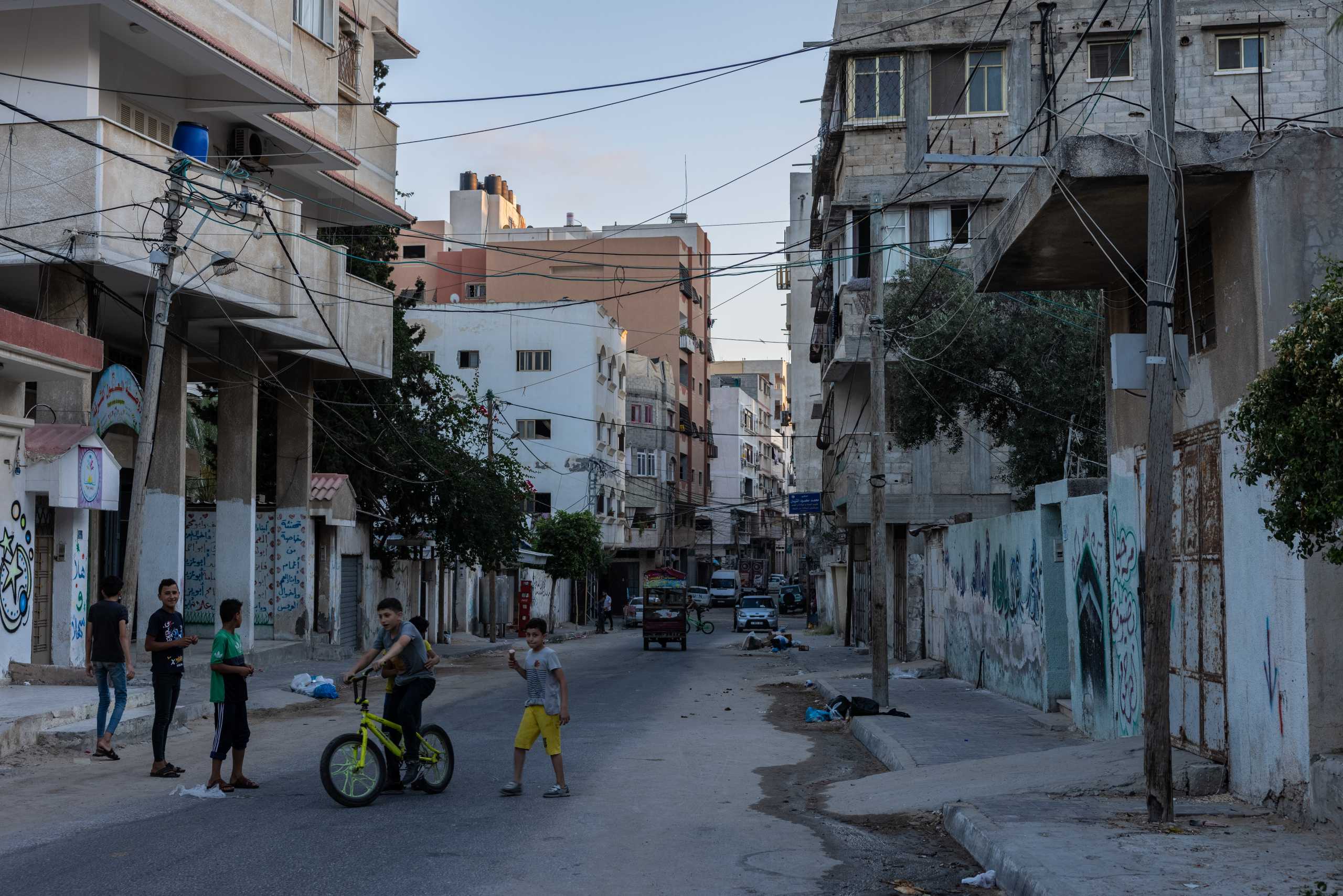 Children play outside their home in central Gaza on June 24, 2021. Stefanie Glinski
