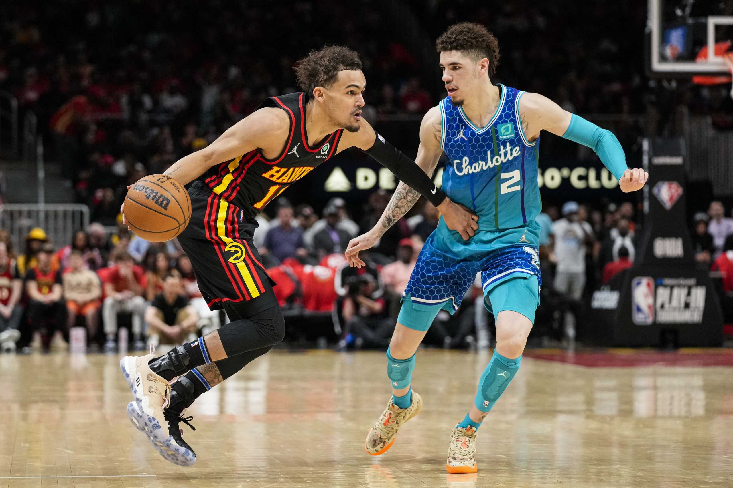 Apr 13, 2022; Atlanta, Georgia, USA; Atlanta Hawks guard Trae Young (11) dribbles defended by Charlotte Hornets guard LaMelo Ball (2) during the second half at State Farm Arena. Mandatory Credit: Dale Zanine-USA TODAY Sports
