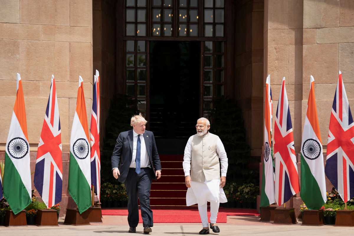 British Prime Minister Boris Johnson and his Indian counterpart Narendra Modi walk before their meeting at the Hyderabad House in New Delhi, India, April 22, 2022. Stefan Rousseau