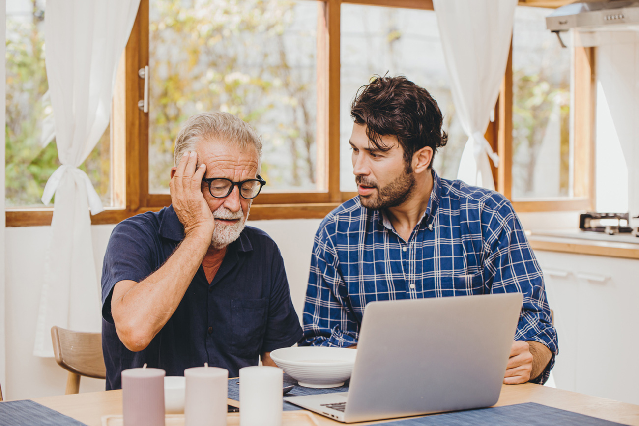 Elder with Alzheimer and dementia lost account forgot username login password help care and consolation from young man son.