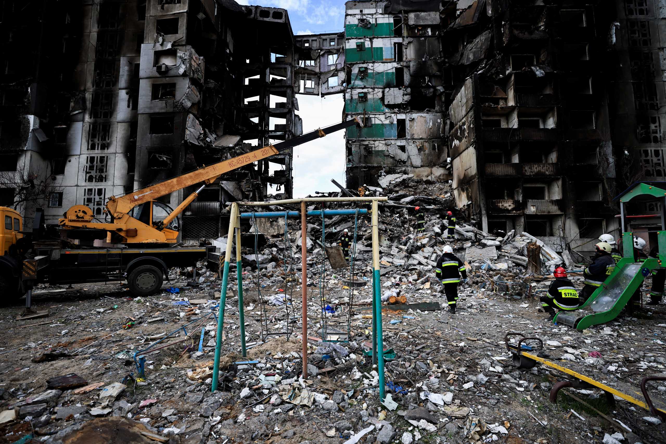A rescuer walks during a search operation for bodies under the rubble of a building destroyed by Russian shelling, amid Russia's Invasion of Ukraine, in Borodyanka, Kyiv region, Ukraine April 11, 2022. REUTERS