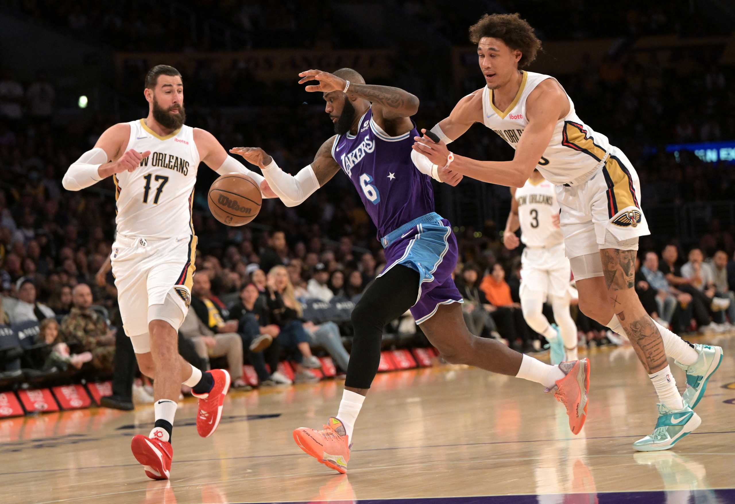 Apr 1, 2022; Los Angeles, California, USA;  New Orleans Pelicans center Jaxson Hayes (10) is charged with a flagrant foul 1 as he elbows Los Angeles Lakers forward LeBron James (6) pushing him into New Orleans Pelicans center Jonas Valanciunas (17) in the first quarter of the game at Crypto.com Arena. Mandatory Credit: Jayne Kamin-Oncea-USA TODAY Sports