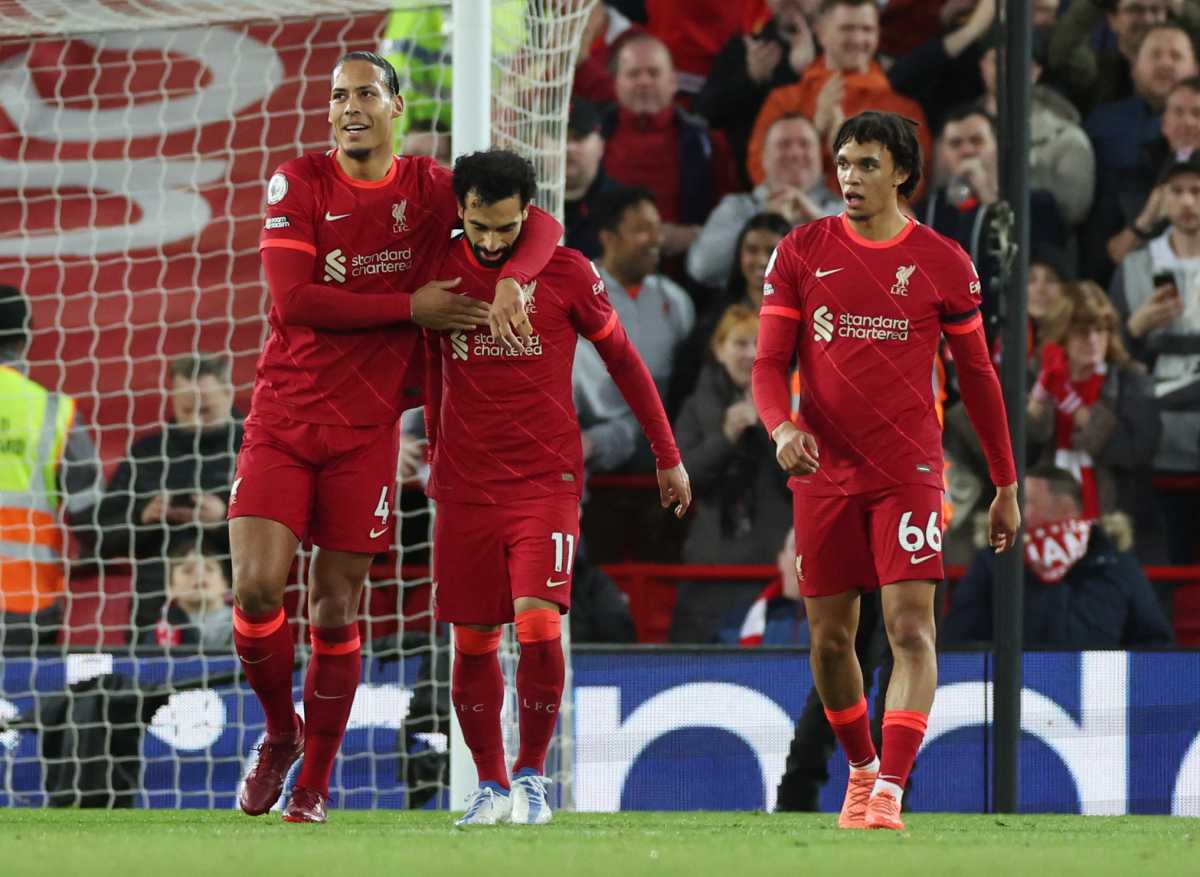 Soccer Football - Premier League - Liverpool v Manchester United - Anfield, Liverpool, Britain - April 19, 2022 Liverpool's Mohamed Salah celebrates scoring their second goal with teammates REUTERS