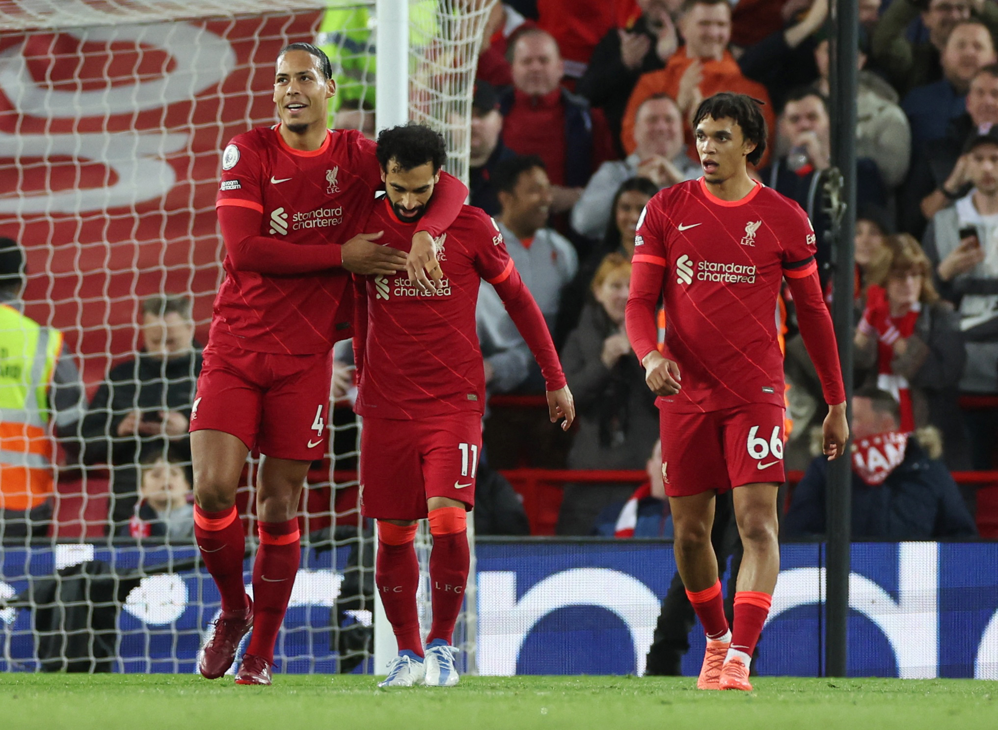 Soccer Football - Premier League - Liverpool v Manchester United - Anfield, Liverpool, Britain - April 19, 2022 Liverpool's Mohamed Salah celebrates scoring their second goal with teammates REUTERS