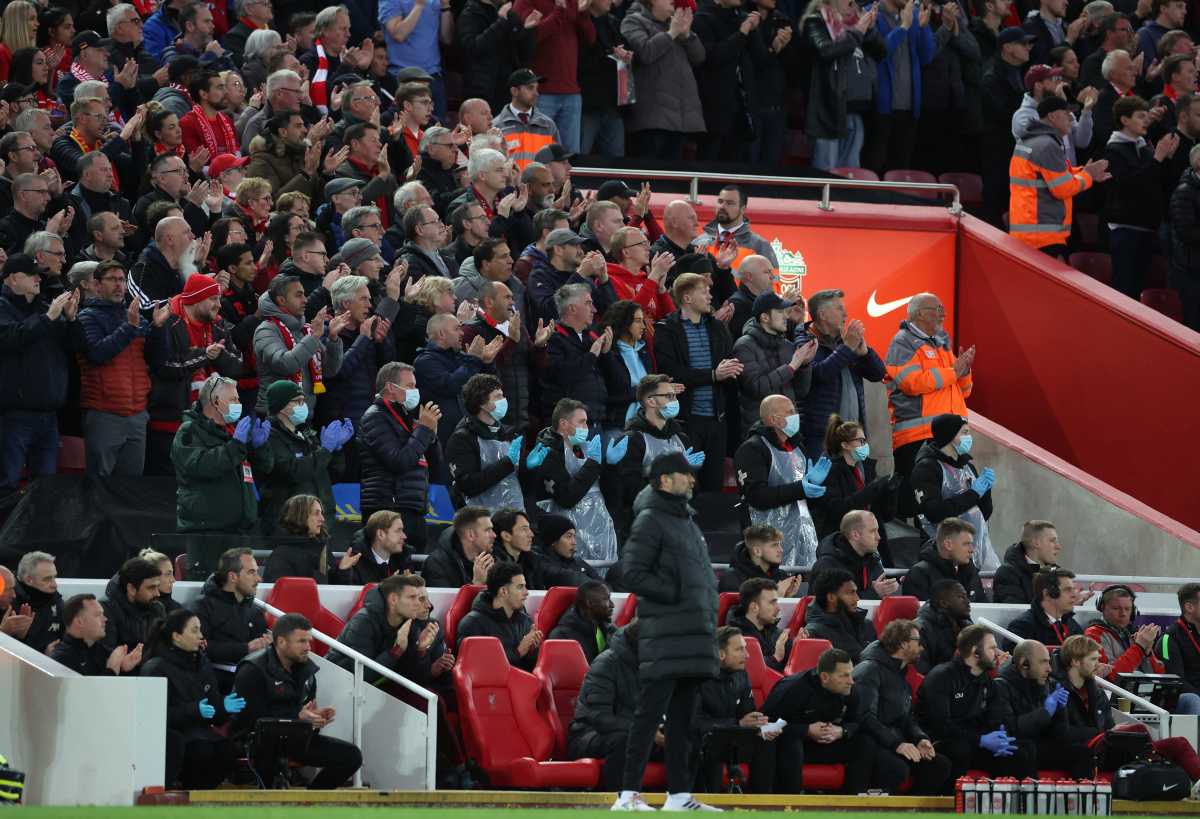 Soccer Football - Premier League - Liverpool v Manchester United - Anfield, Liverpool, Britain - April 19, 2022 Liverpool fans applaud on the seventh minute for Manchester United 's Cristiano Ronaldo and his family REUTERS