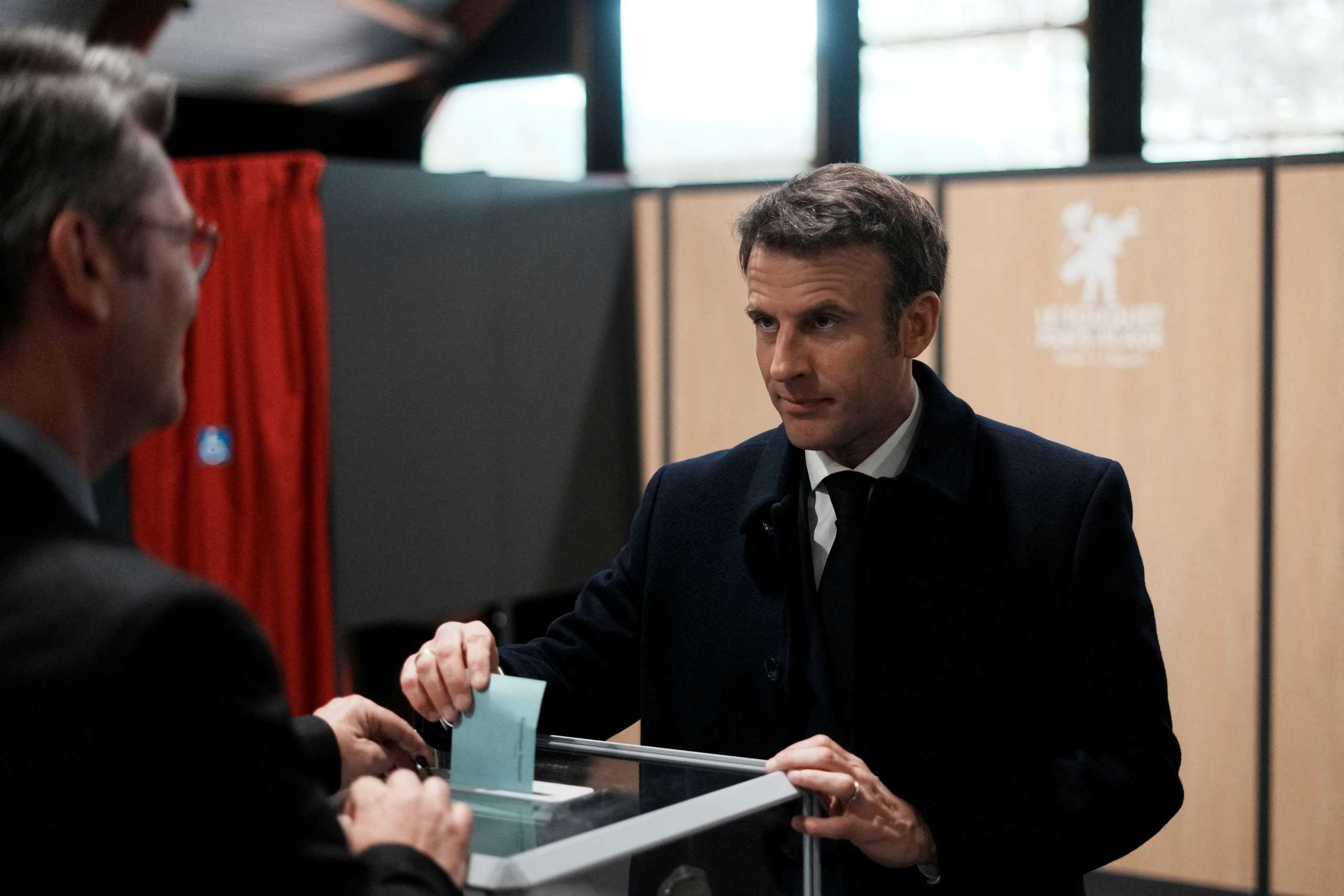 French President and centrist presidential candidate for reelection Emmanuel Macron casts his ballot on the day of the first round of the presidential election, in Le Touquet, northern France April 10, 2022. Thibault Camus