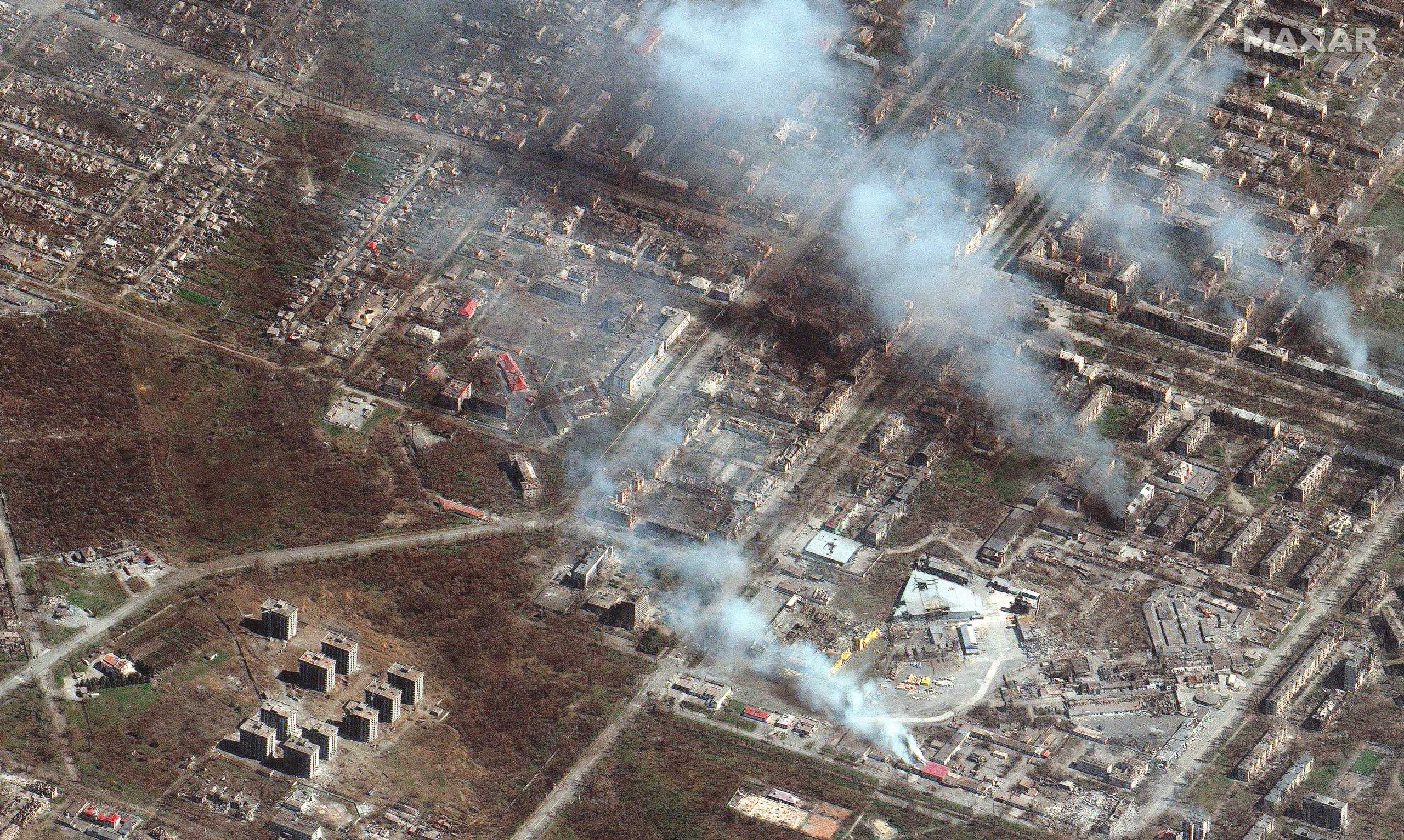 A satellite image shows buildings on fire in eastern Mariupol, Ukraine, April 9, 2022. Picture taken April 9, 2022. Satellite image 2022 Maxar Technologies
