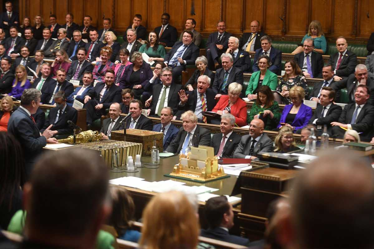 Conservative Party MPs react as British Labour Party opposition leader Keir Starmer gestures during Prime Minister's Questions at the House of Commons in London, Britain April 27, 2022. UK Parliament