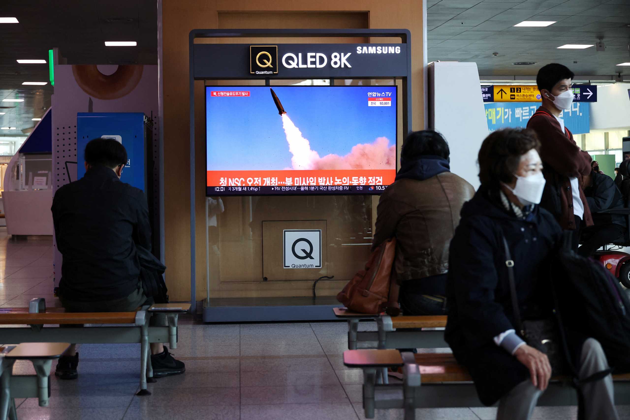 People watch a television broadcasting a news report on North Korea's new type of tactical guided weapon test, at a railway station in Seoul, South Korea, April 17, 2022.   REUTERS