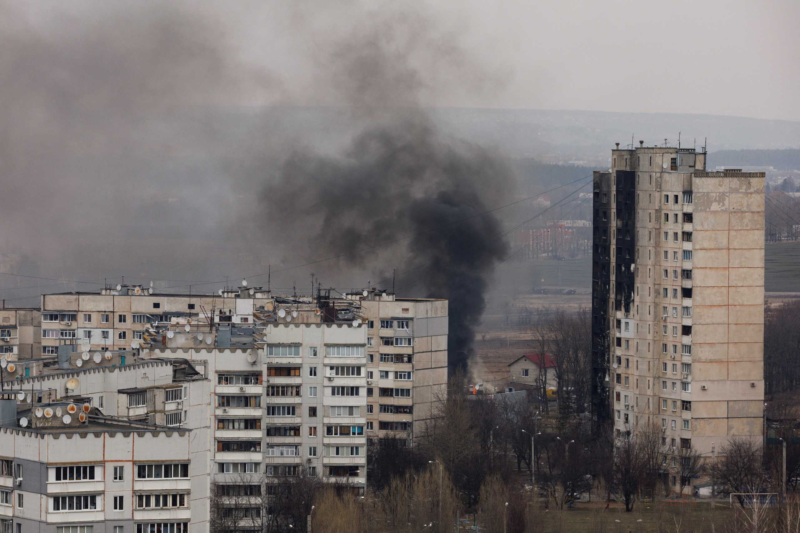 Smoke rises from a residential building after shelling from Russian positions in northern Kharkiv as Russia's attack on Ukraine continues, Ukraine, March 31 2022.  REUTERS