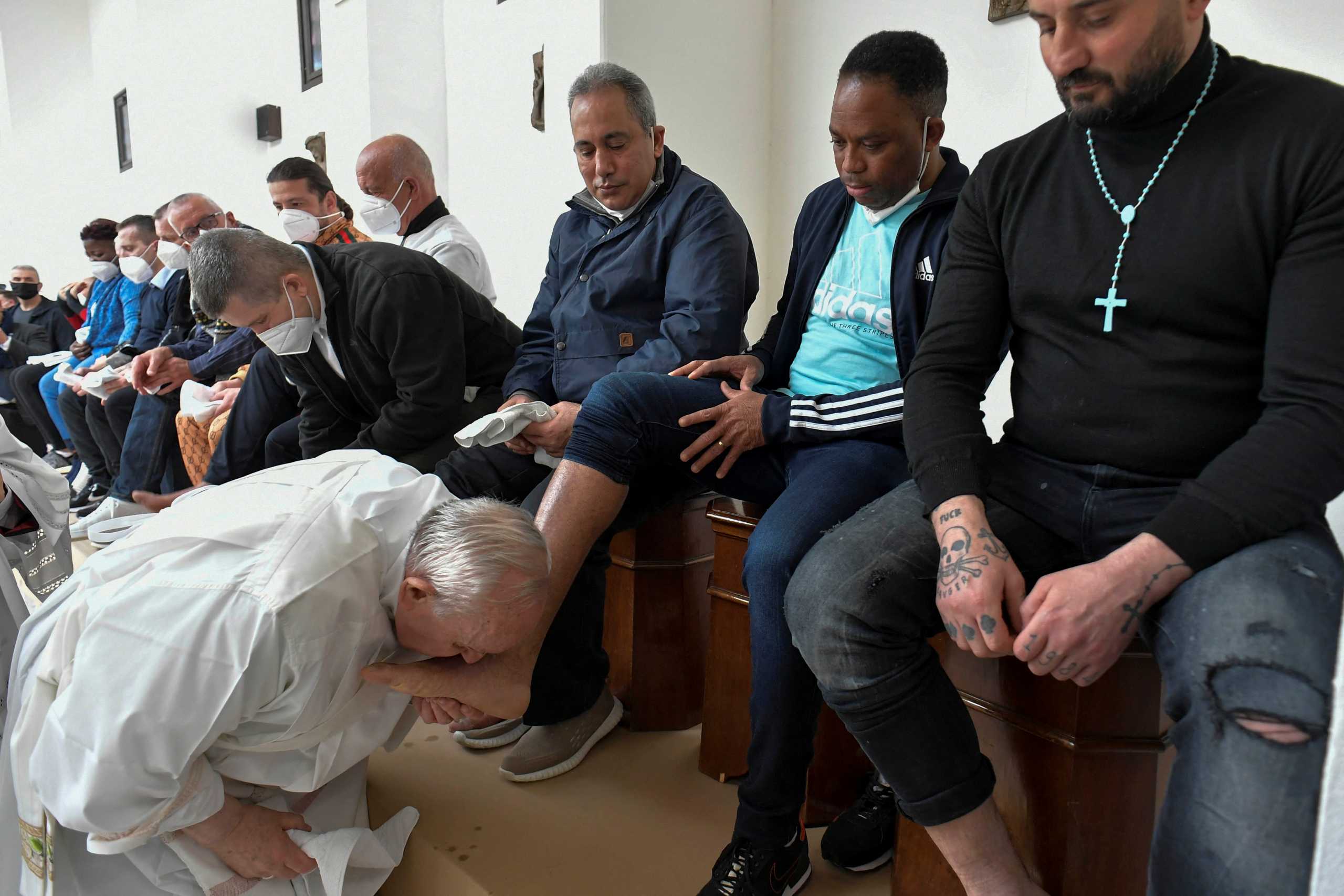 Pope Francis washes the feet of inmates at the Civitavecchia prison in Civitavecchia, Italy, April 14, 2022. Vatican Media