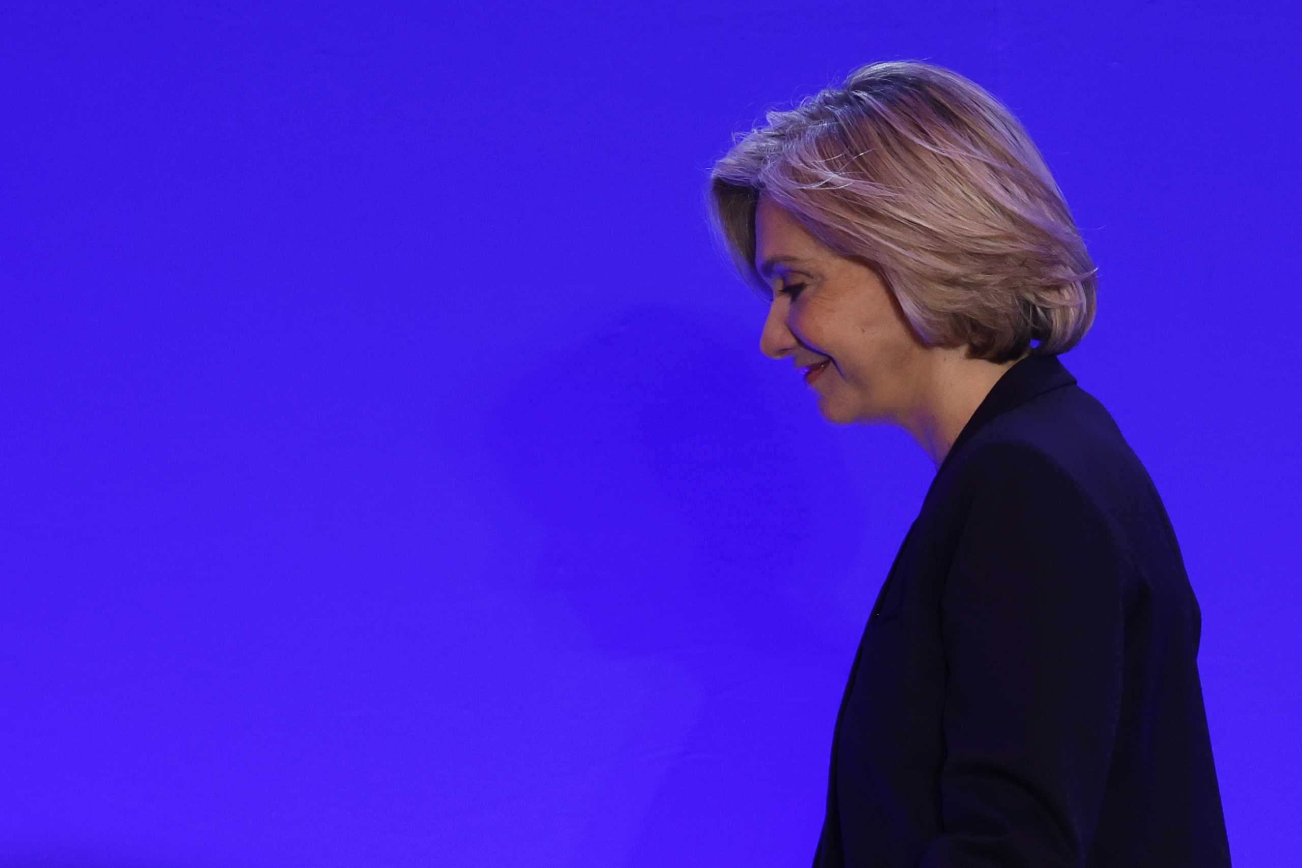 Valerie Pecresse, head of the Paris Ile-de-France region and Les Republicains (LR) conservative party candidate for the 2022 French presidential election, leaves the stage after the speech, as partial results in the first round of the 2022 French presidential election are announced, in Paris, France, April 10, 2022. REUTERS