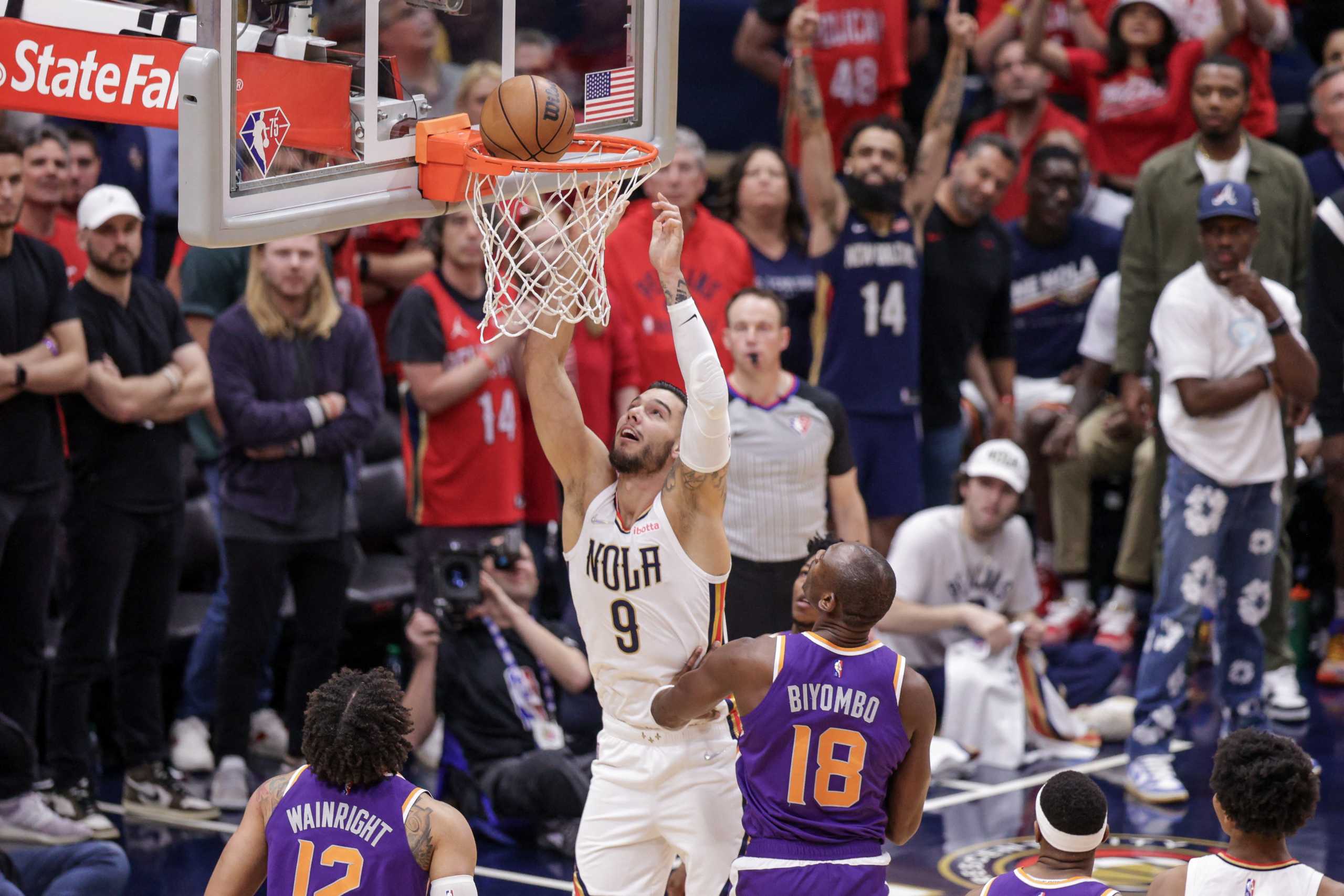 Apr 24, 2022; New Orleans, Louisiana, USA;  New Orleans Pelicans center Willy Hernangomez (9) shoots a lay up against Phoenix Suns center Bismack Biyombo (18) during the second half of game four of the first round of the 2022 NBA playoffs at Smoothie King Center. Mandatory Credit: Stephen Lew-USA TODAY Sports