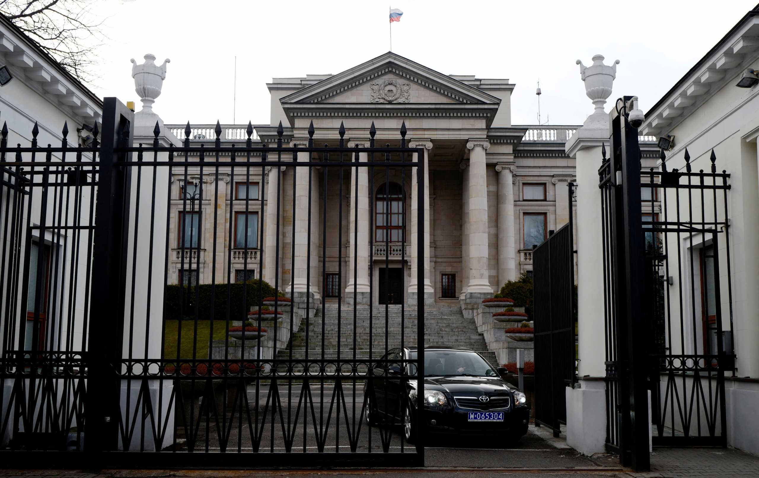 FILE PHOTO: A car leaves through the gate of the Russian embassy building in Warsaw, Poland March 26, 2018. REUTERS