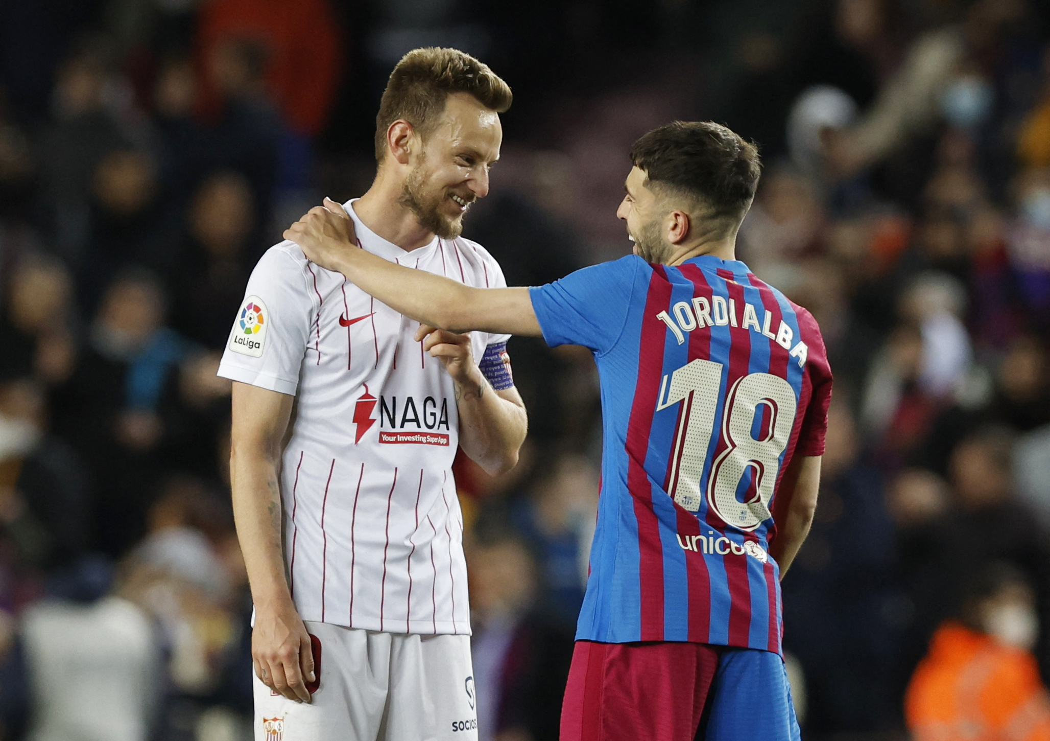 Soccer Football - LaLiga - FC Barcelona v Sevilla - Camp Nou, Barcelona, Spain - April 3, 2022 Sevilla's Ivan Rakitic speaks with FC Barcelona's Jordi Alba after the match REUTERS