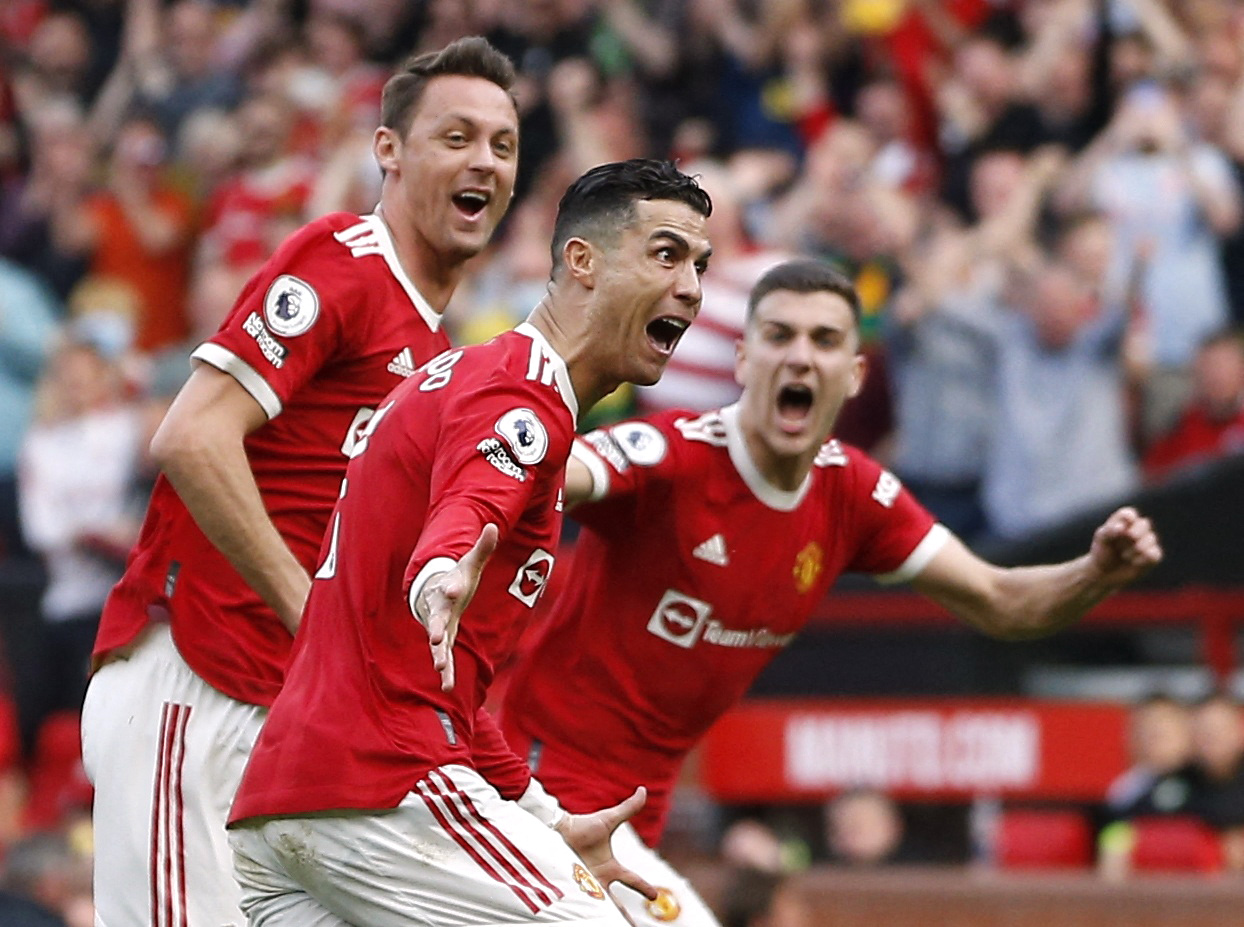 Soccer Football - Premier League - Manchester United v Norwich City - Old Trafford, Manchester, Britain - April 16, 2022 Manchester United's Cristiano Ronaldo celebrates scoring their third goal with Nemanja Matic REUTERS