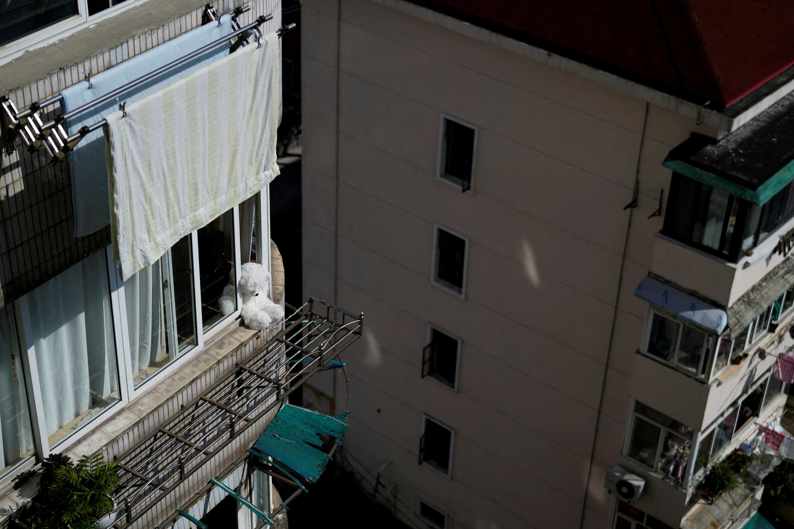 A toy is seen on a window, during the second stage of a two-stage lockdown to curb the spread of the coronavirus disease (COVID-19), in Shanghai, China April 4, 2022. REUTERS