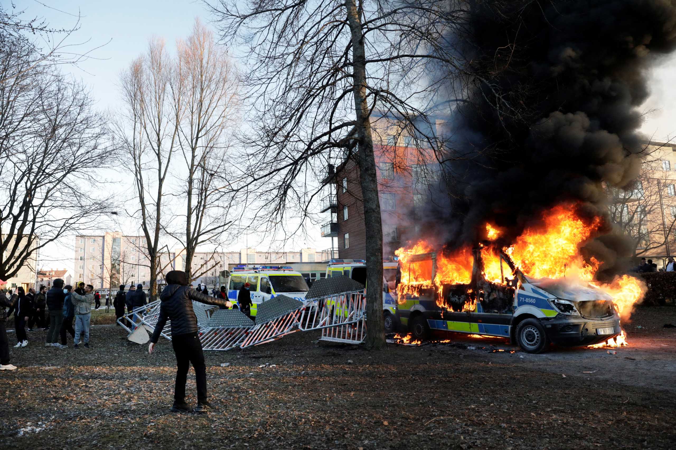 Counter-protesters set fire to a police bus ahead of a demonstration planned by Danish anti-Muslim politician Rasmus Paludan and his Stram Kurs party, which was to include a burning of the Muslim holy book, the Koran,  in the park Sveaparken in Orebro, Sweden,  April 15, 2022. Kicki Nilsson
