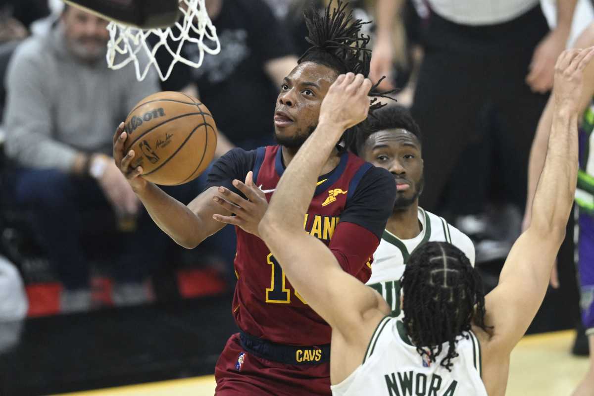 Apr 10, 2022; Cleveland, Ohio, USA; Cleveland Cavaliers guard Darius Garland (10) drives to the basket beside Milwaukee Bucks forward Jordan Nwora (13) in the first quarter at Rocket Mortgage FieldHouse. Mandatory Credit: David Richard-USA TODAY Sports