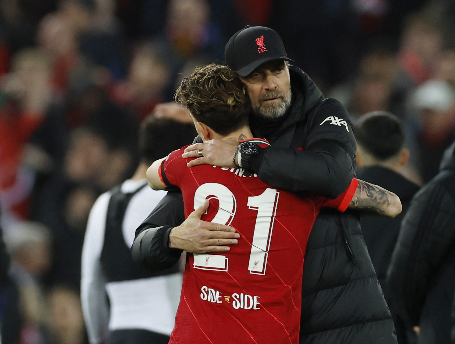 Soccer Football - Champions League - Quarter Final - Second Leg - Liverpool v Benfica - Anfield, Liverpool, Britain - April 13, 2022 Liverpool manager Juergen Klopp and Kostas Tsimikas celebrate after the match Action Images via Reuters