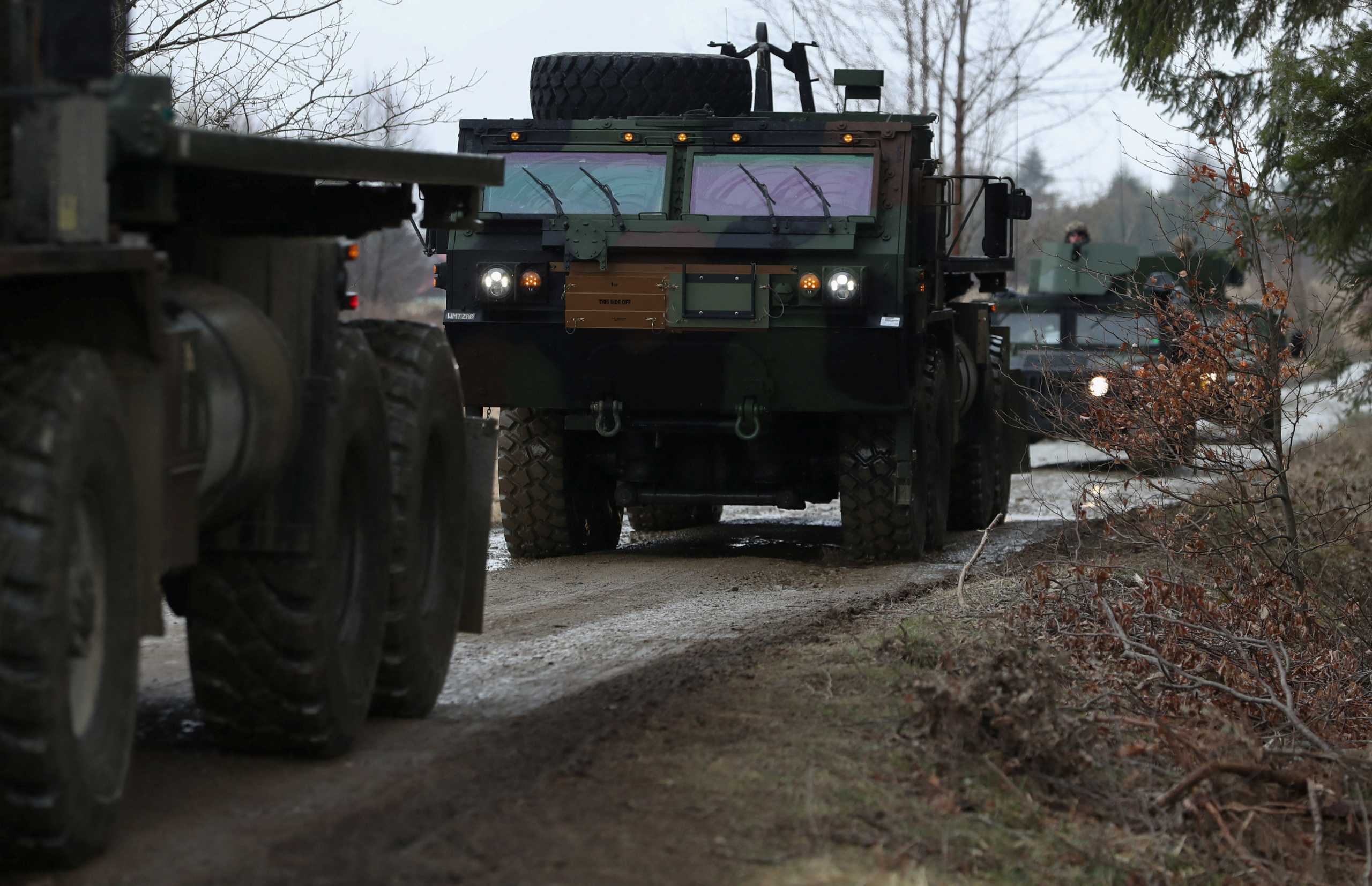U.S. Army soldiers from the 82nd Airborne Division drive military trucks towards an airbase, amid Russia's invasion of Ukraine, near Arlamow ,Poland, April 5, 2022. REUTERS