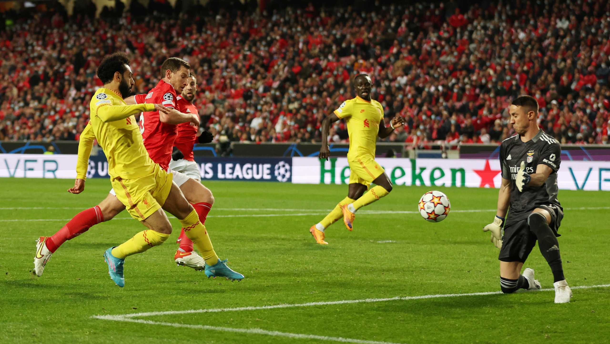 Soccer Football - Champions League - Quarter Final - First Leg - Benfica v Liverpool - Estadio da Luz, Lisbon, Portugal - April 5, 2022 Liverpool's Mohamed Salah in action with Benfica's Odisseas Vlachodimos Action Images via Reuters