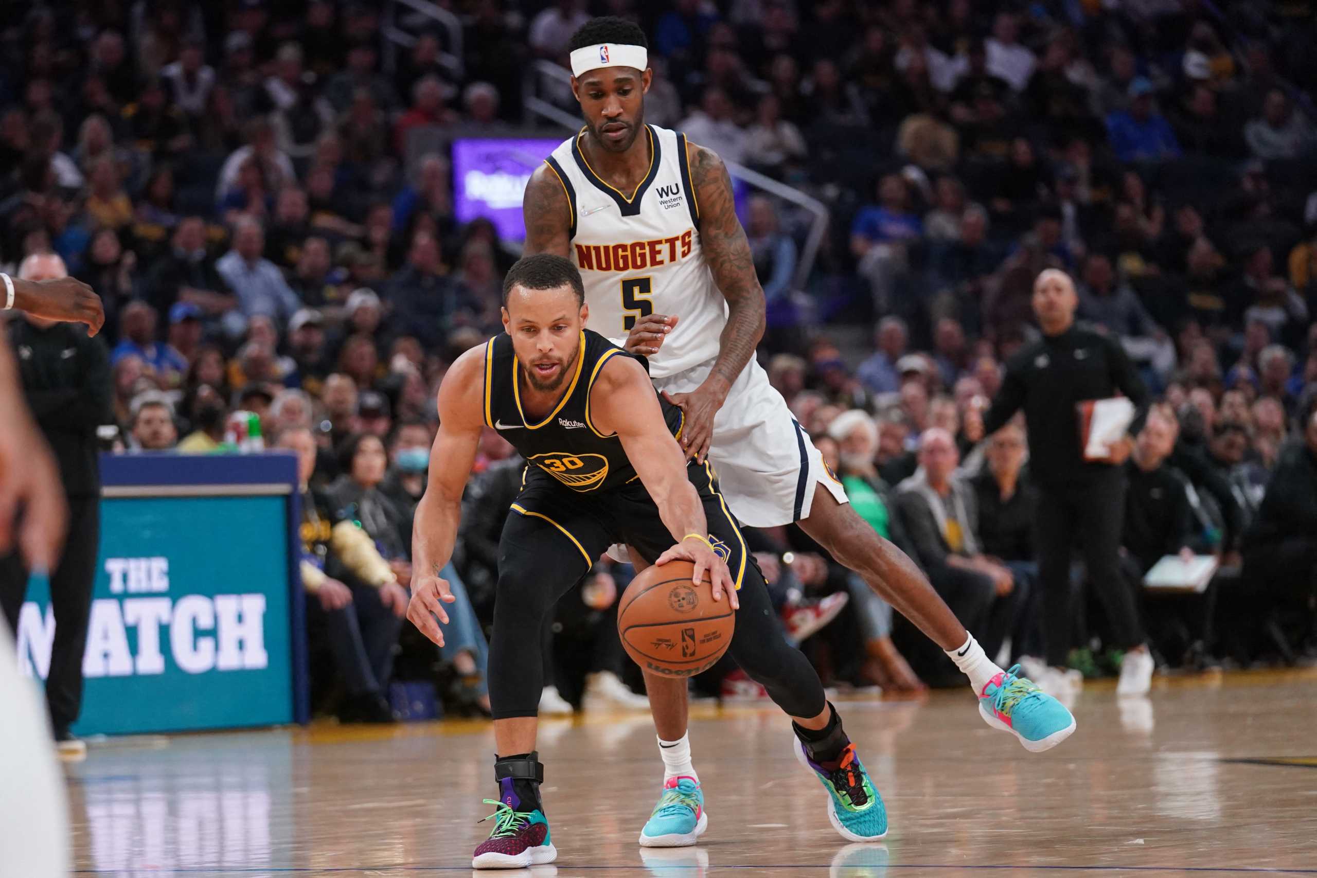Apr 27, 2022; San Francisco, California, USA; Golden State Warriors guard Stephen Curry (30) dribbles the ball in front of Denver Nuggets guard Will Barton (5) in the second quarter during game five of the first round for the 2022 NBA playoffs at Chase Center. Mandatory Credit: Cary Edmondson-USA TODAY Sports