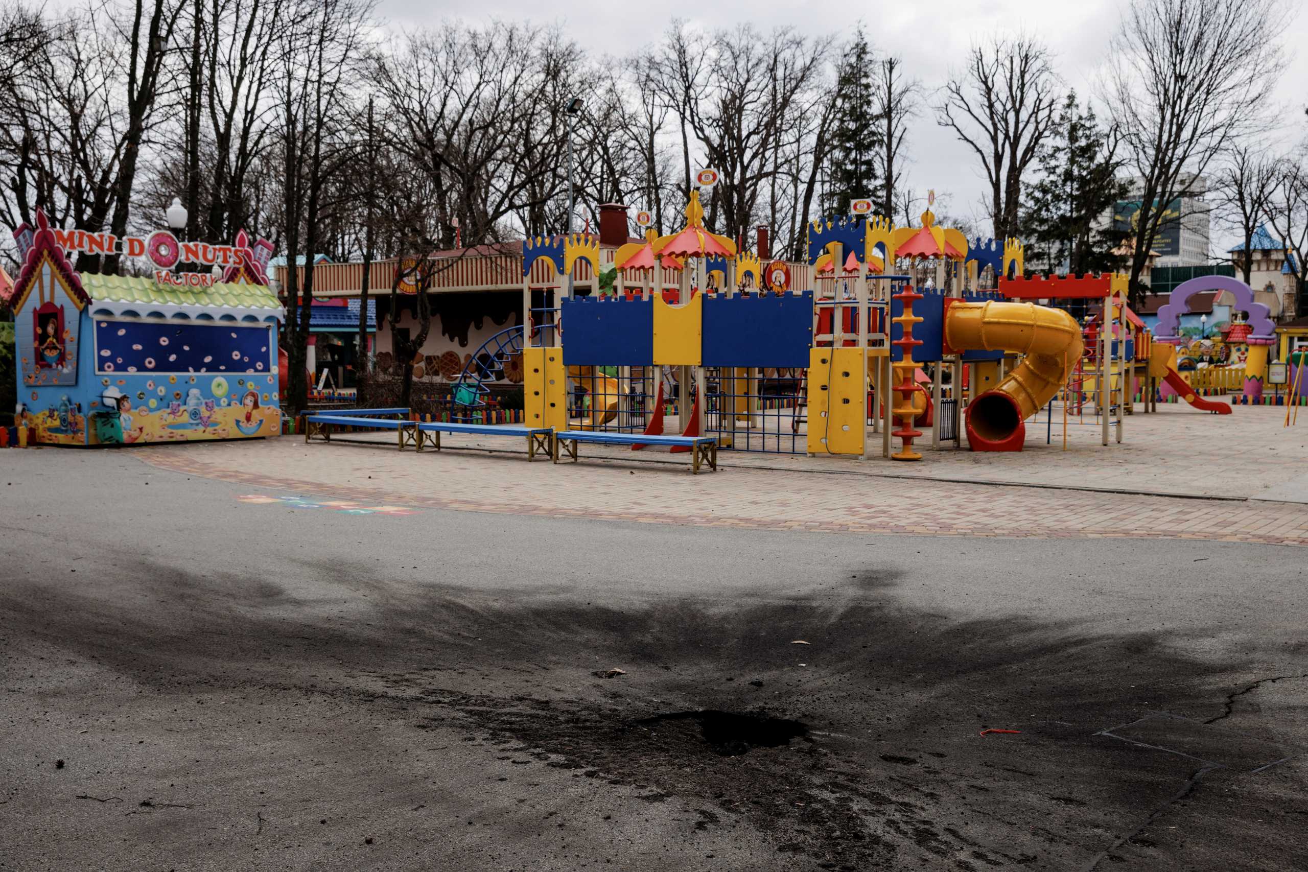 The impact of a shell that hit the ground from the direction of Russian positions is seen in the Gorky Park, an amusement park in Kharkiv, as Russia's attack on Ukraine continues, Ukraine, April 2 2022.  REUTERS