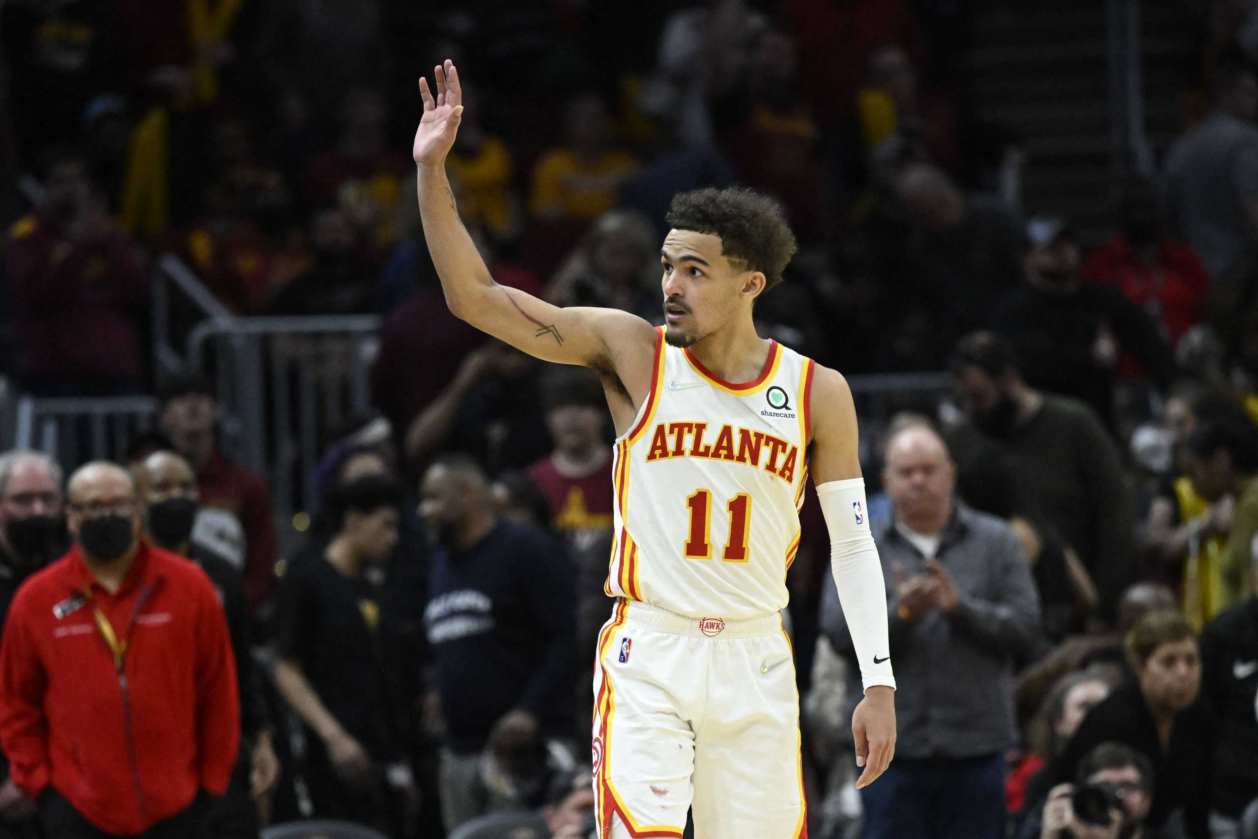 Apr 15, 2022; Cleveland, Ohio, USA; Atlanta Hawks guard Trae Young (11) waves to fans after a win against the Cleveland Cavaliers at Rocket Mortgage FieldHouse. Mandatory Credit: David Richard-USA TODAY Sports
