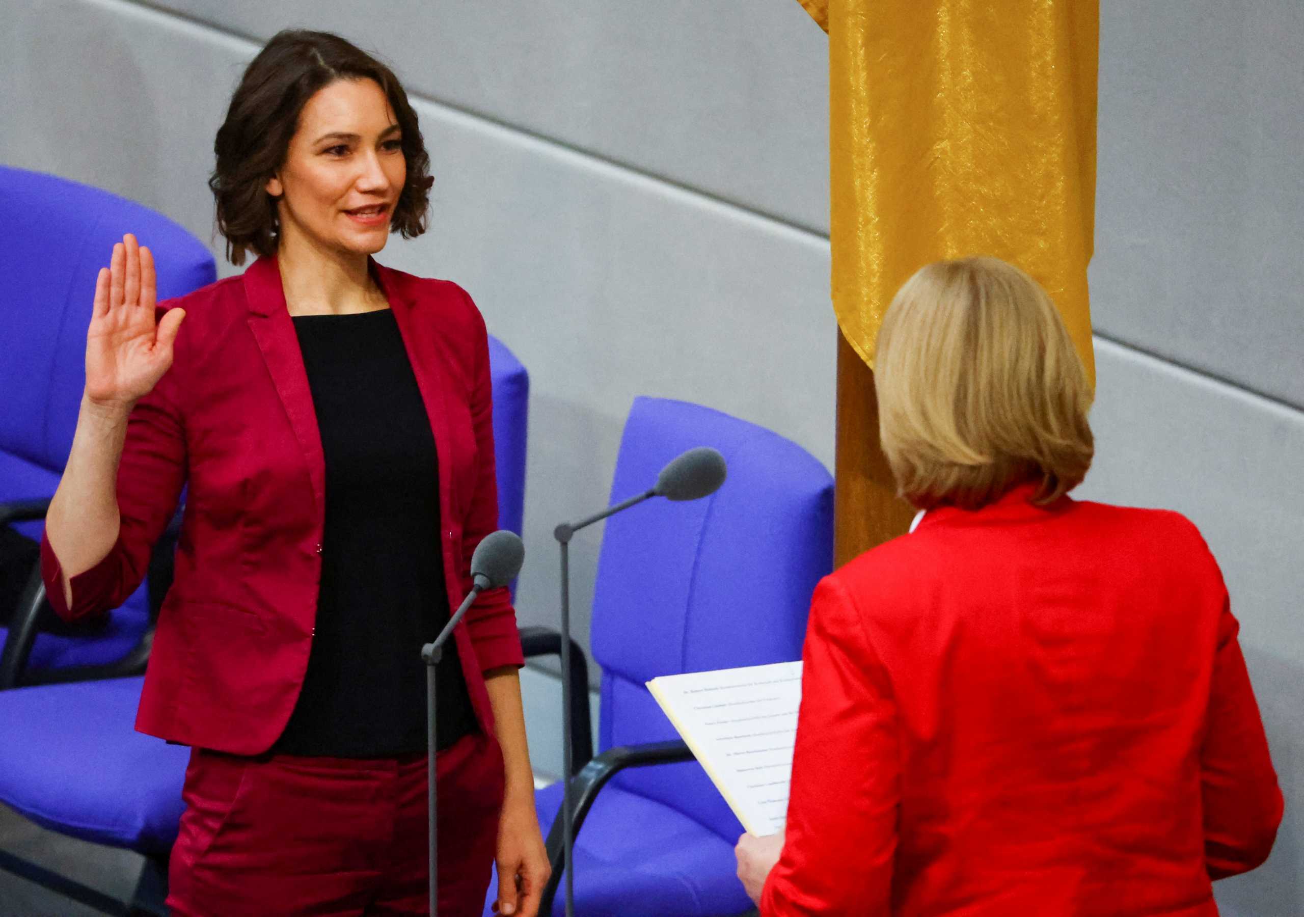 FILE PHOTO: German Minister for Family Affairs, Senior Citizens, Women and Youth Anne Spiegel is sworn-in by Parliament President Baerbel Bas during a session of the German lower house of parliament Bundestag, in Berlin, Germany, December 8, 2021. REUTERS