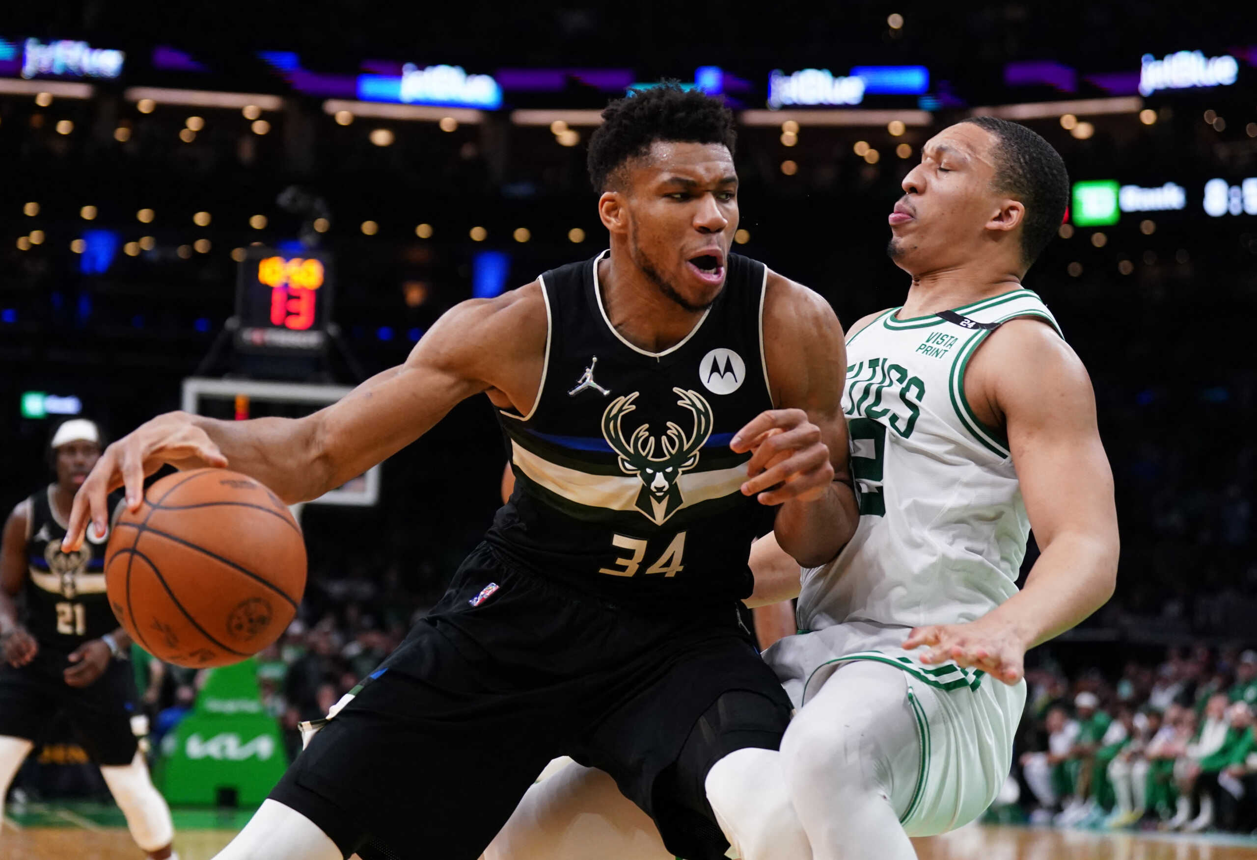 May 11, 2022; Boston, Massachusetts, USA; Milwaukee Bucks forward Giannis Antetokounmpo (34) fouls Boston Celtics forward Grant Williams (12) in the second half during game five of the second round for the 2022 NBA playoffs at TD Garden. Mandatory Credit: David Butler II-USA TODAY Sports
